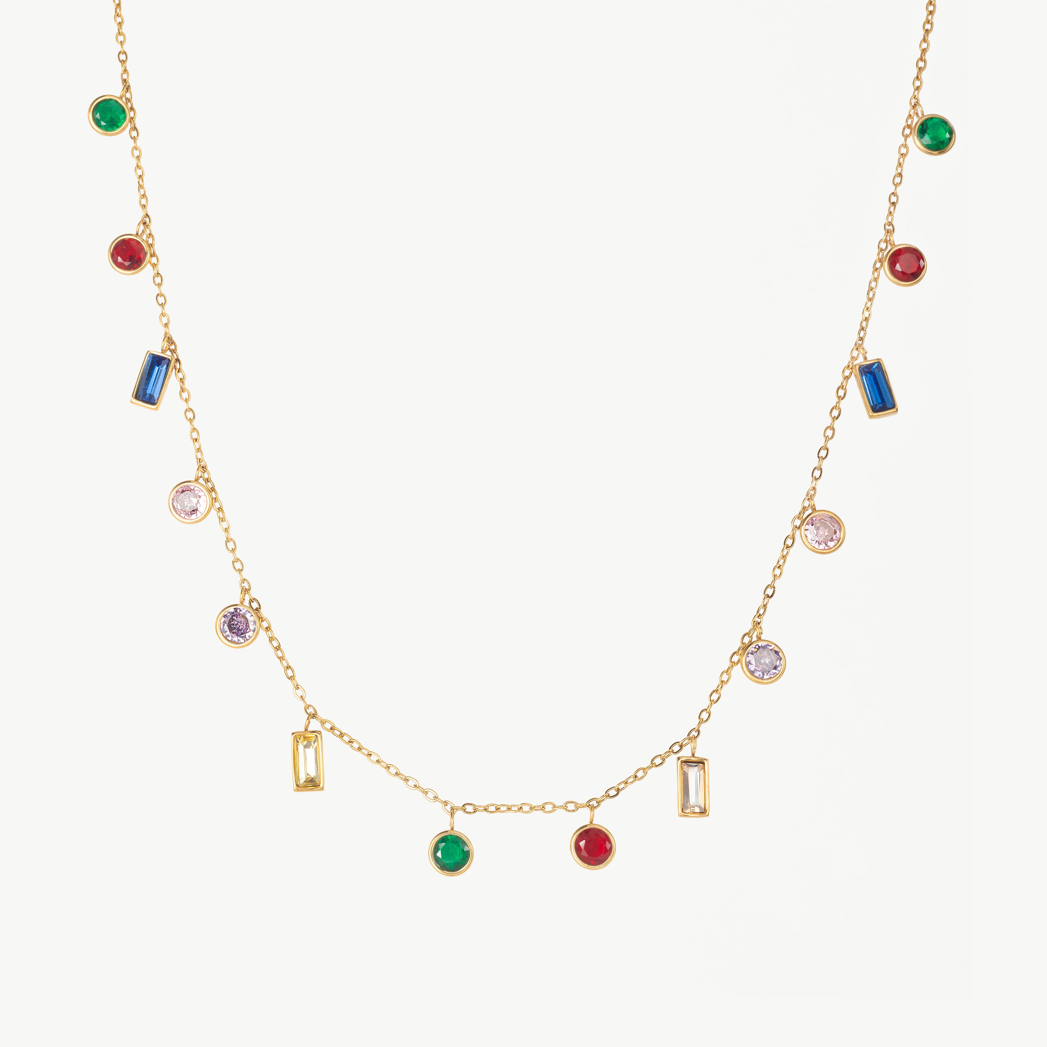 gemstone necklace in gold with multiple colorful stones, multi gemstone station necklace gold styled as a rainbow gem necklace creating a soft, scattered colour effect