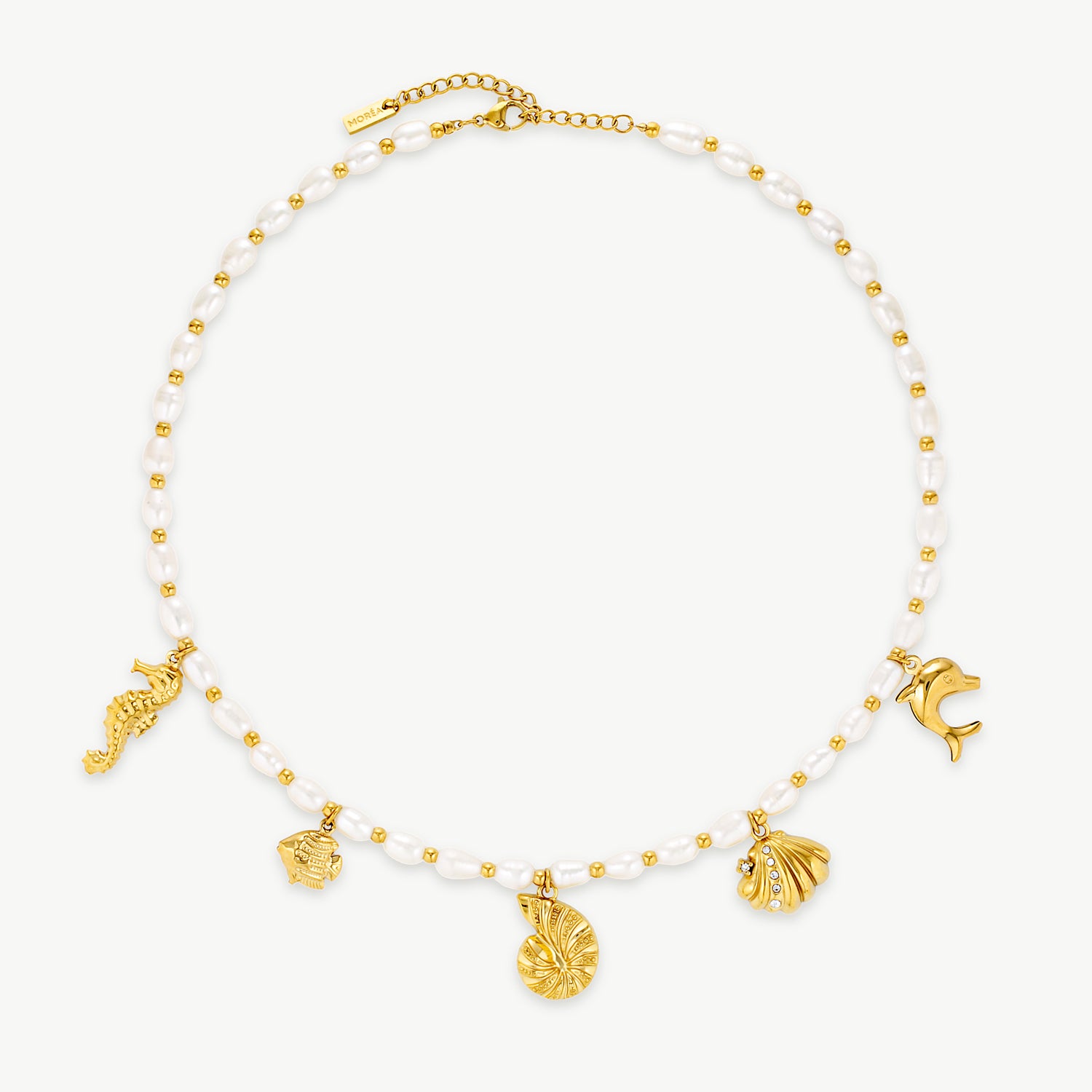 beach charm necklace with white beads and polished gold seashell and ocean-inspired charms