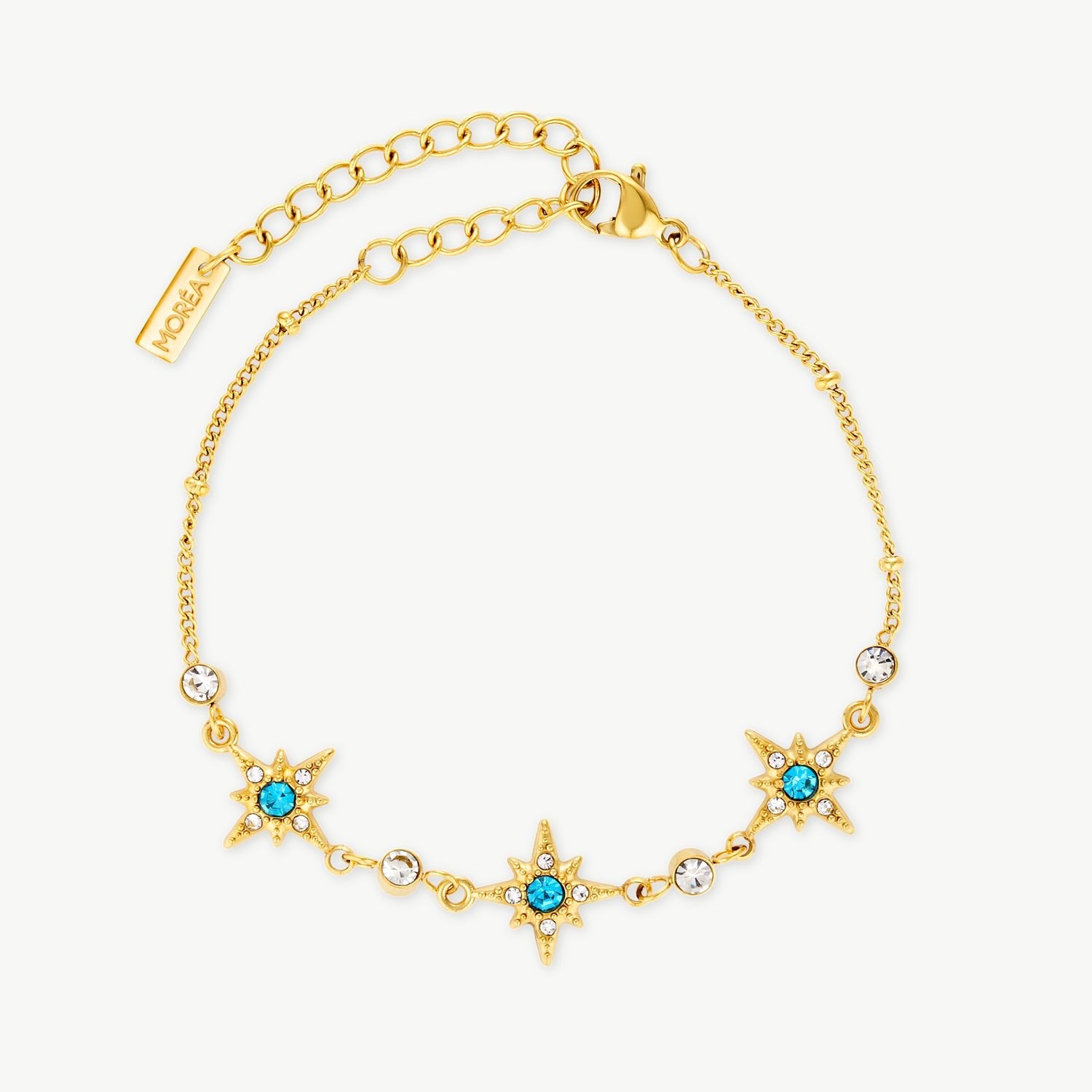 blue star bracelet with gold star charms, blue cubic zirconia and clear crystal accents