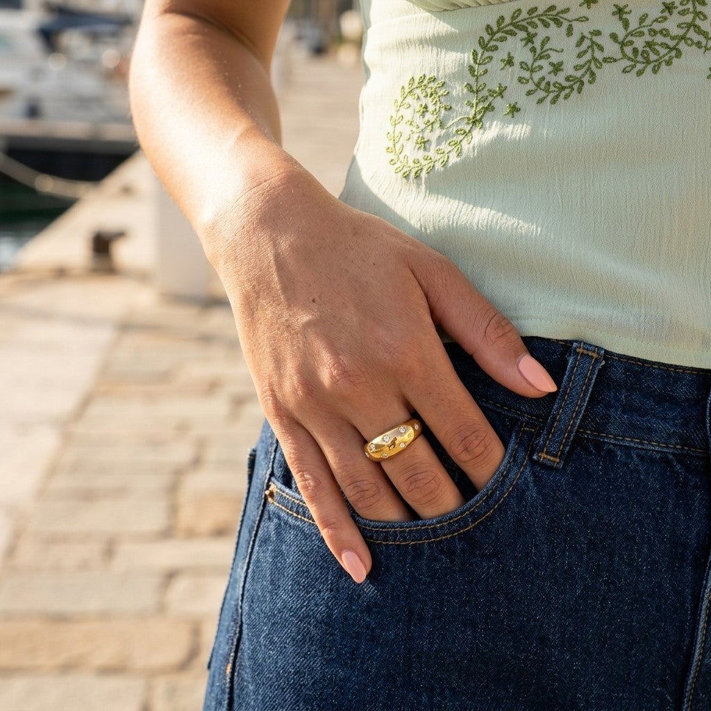 celestial gold ring with sparkling moon and star details set across a polished domed band
