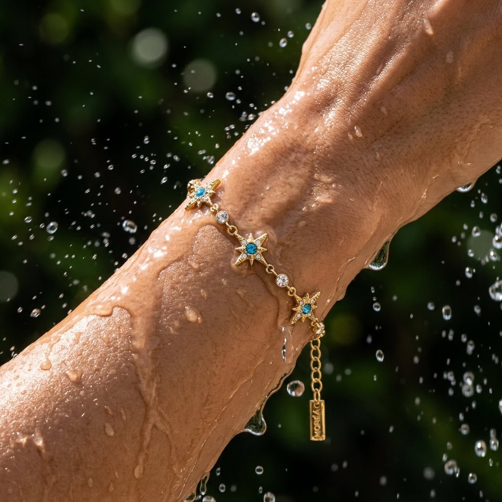 celestial star bracelet with gold starbursts, blue stones and crystal details