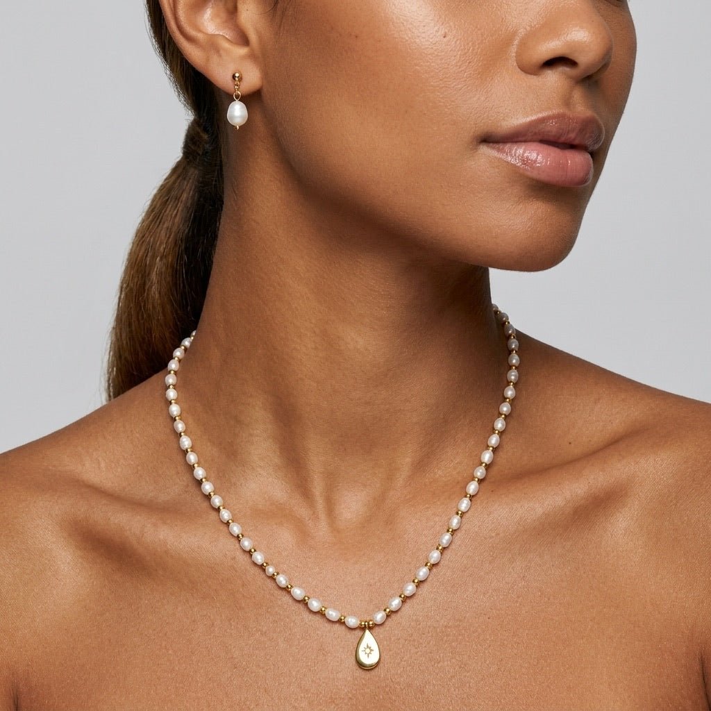 celestial star pearl necklace with white pearls and gold star charm