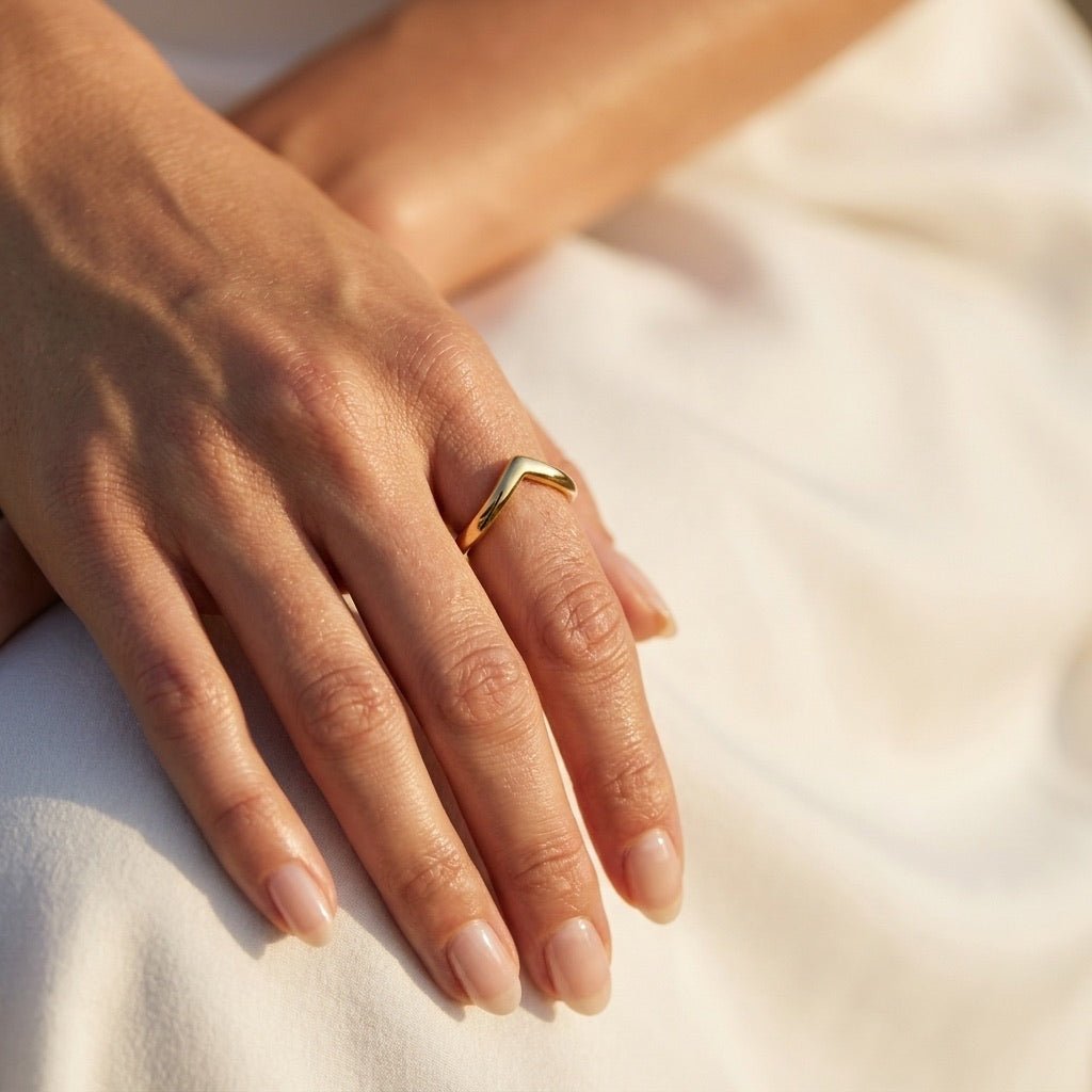 chevron gold band ring with a clean pointed shape and smooth polished finish