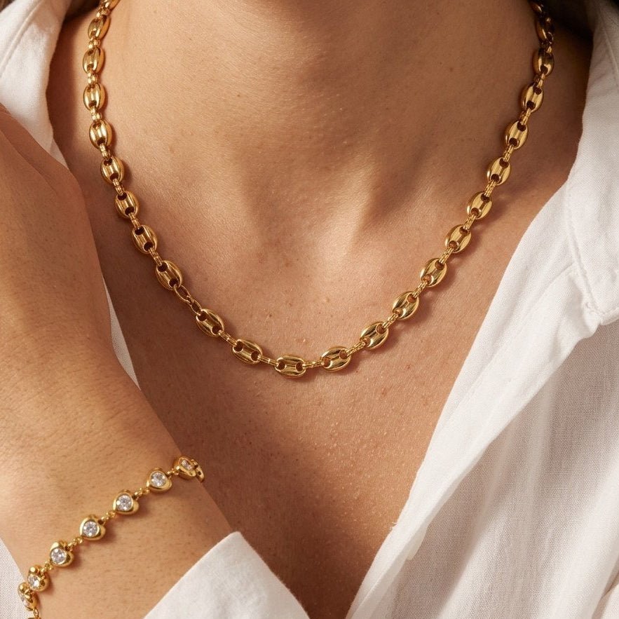 chunky gold anchor necklace featuring substantial interlocking links with a polished gold-tone finish