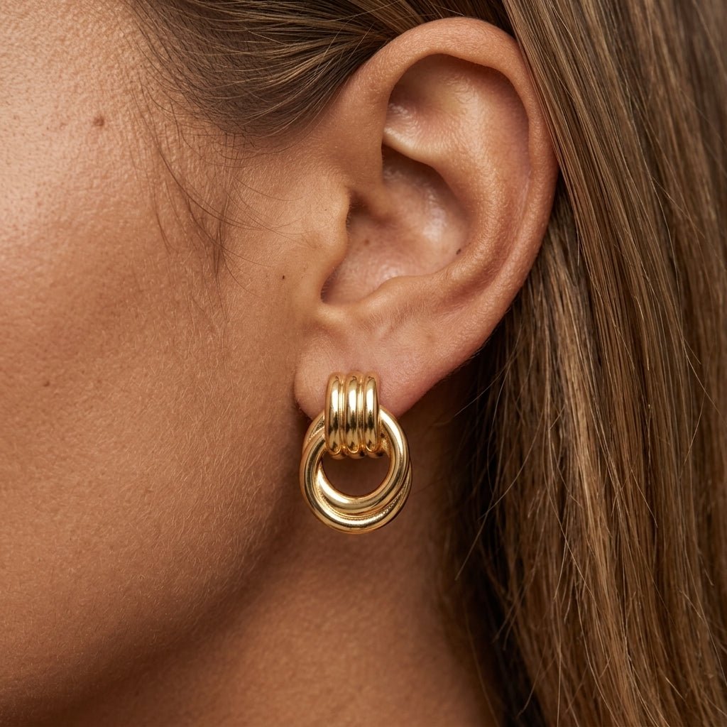 chunky textured gold hoop earrings with sculptural detailing