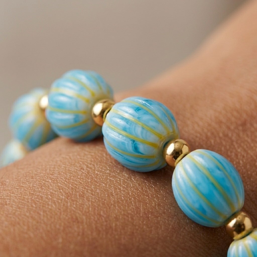 coastal blue beaded bracelet for women featuring striped turquoise beads and gold accents
