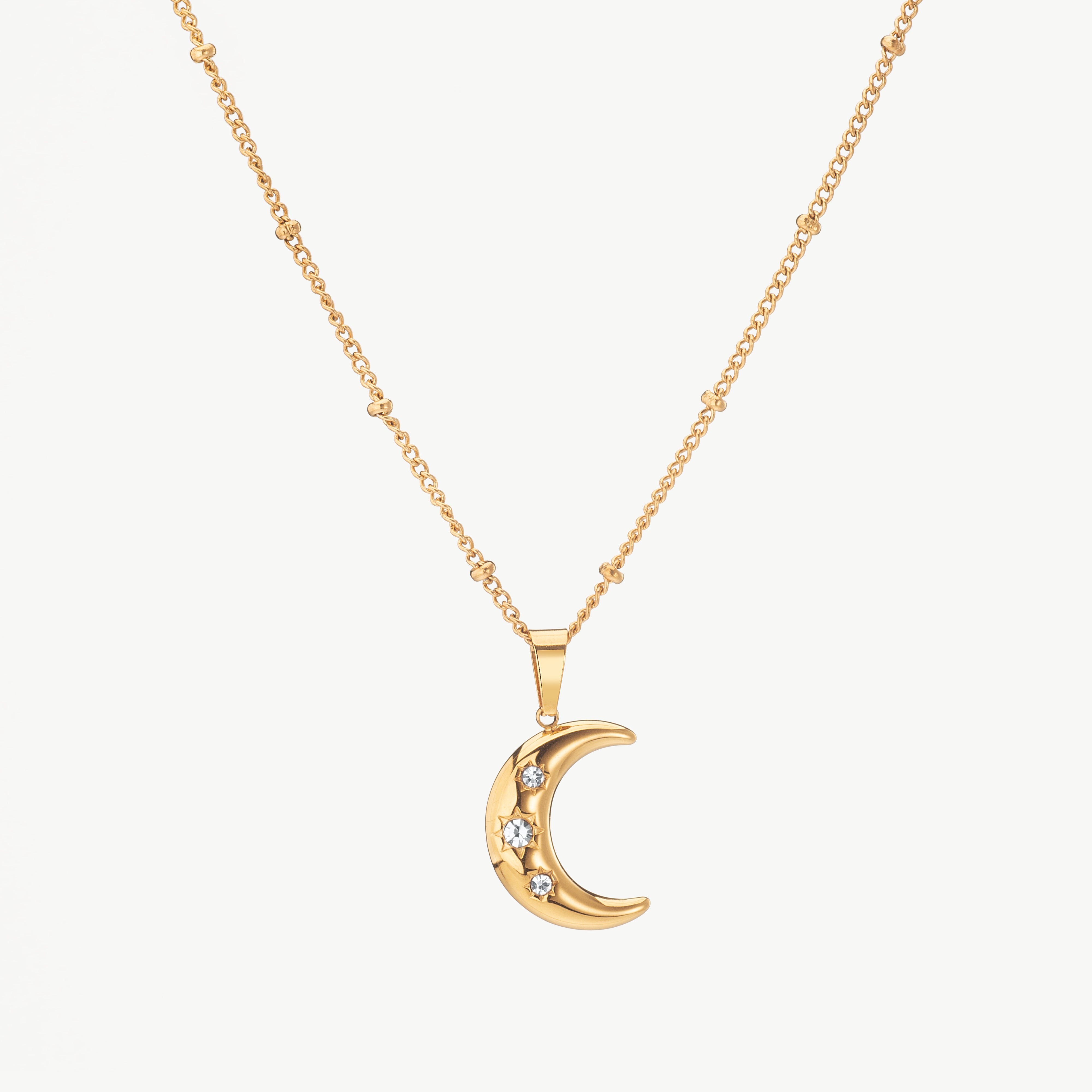 crescent moon necklace in gold with curved pendant, gold crescent moon necklace with polished finish and dainty moon necklace styling
