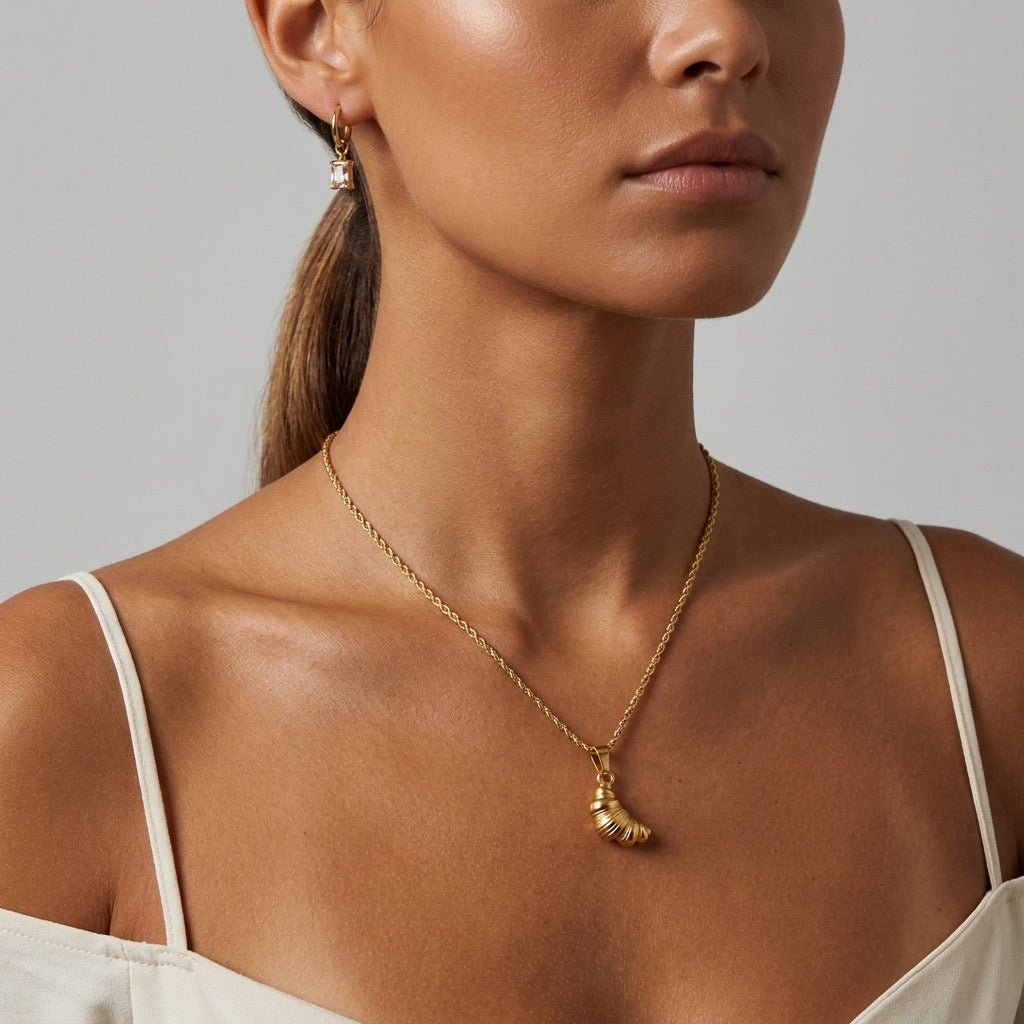 gold croissant charm necklace with textured pastry inspired pendant