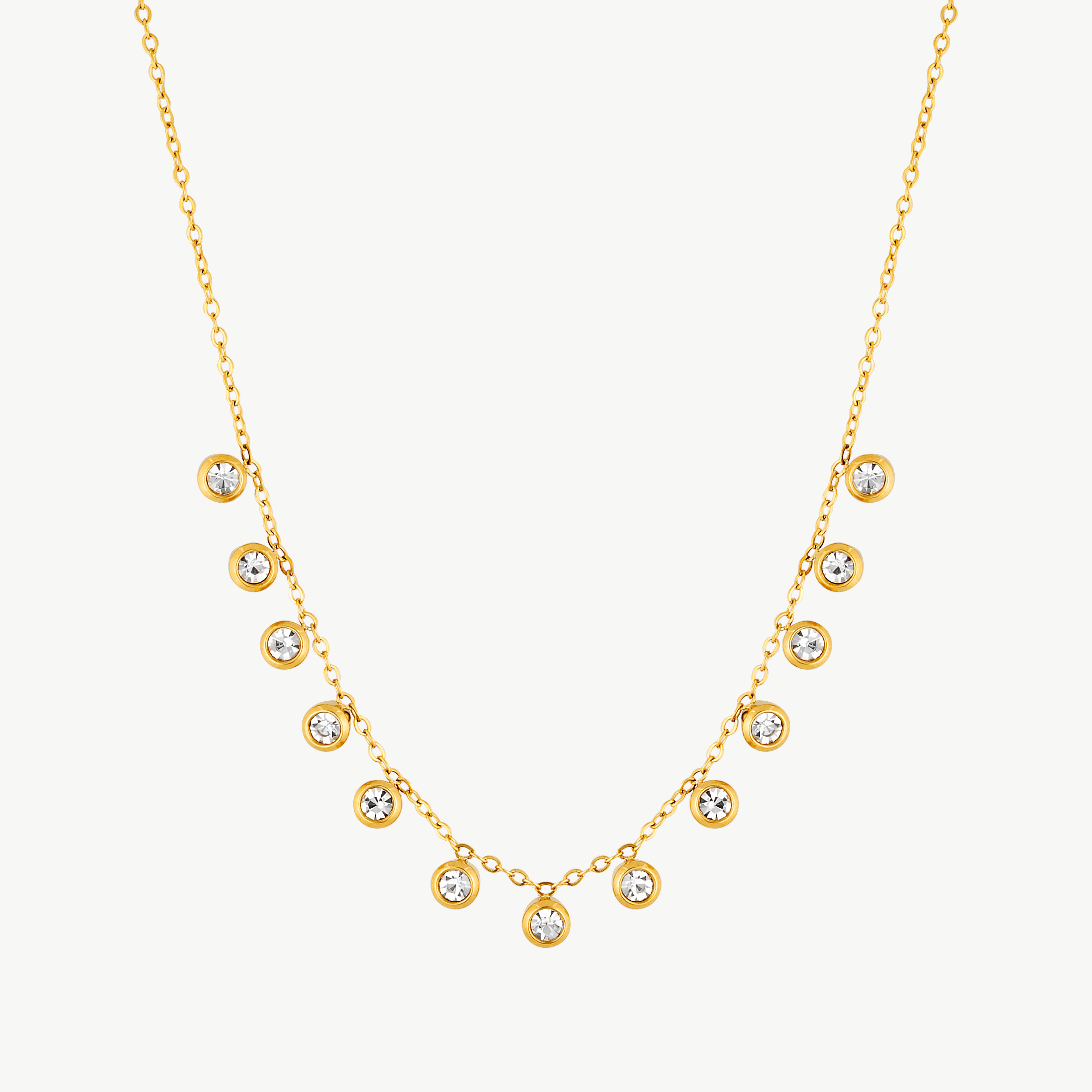 crystal drop necklace with clear round stones in gold tone settings spaced along a delicate golden chain