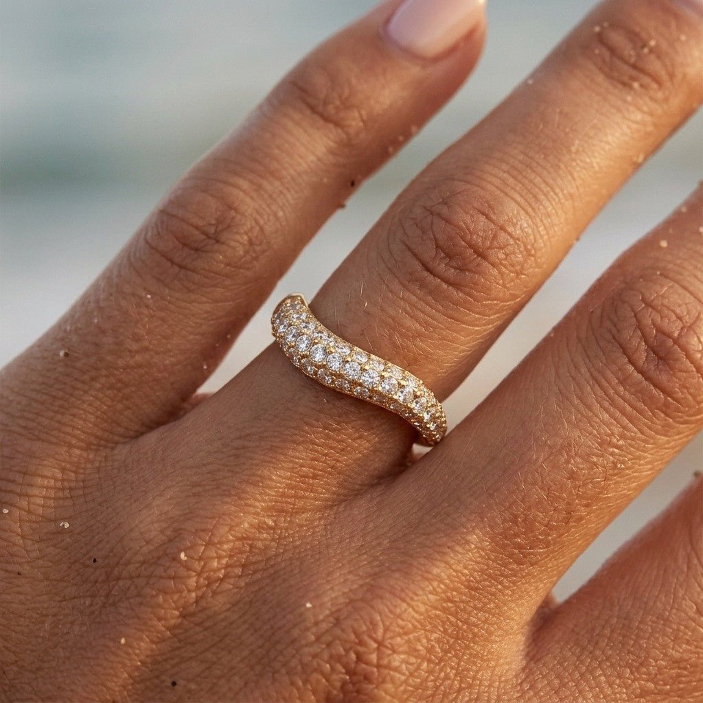 crystal stone ring with rows of sparkling clear stones set across a curved gold band