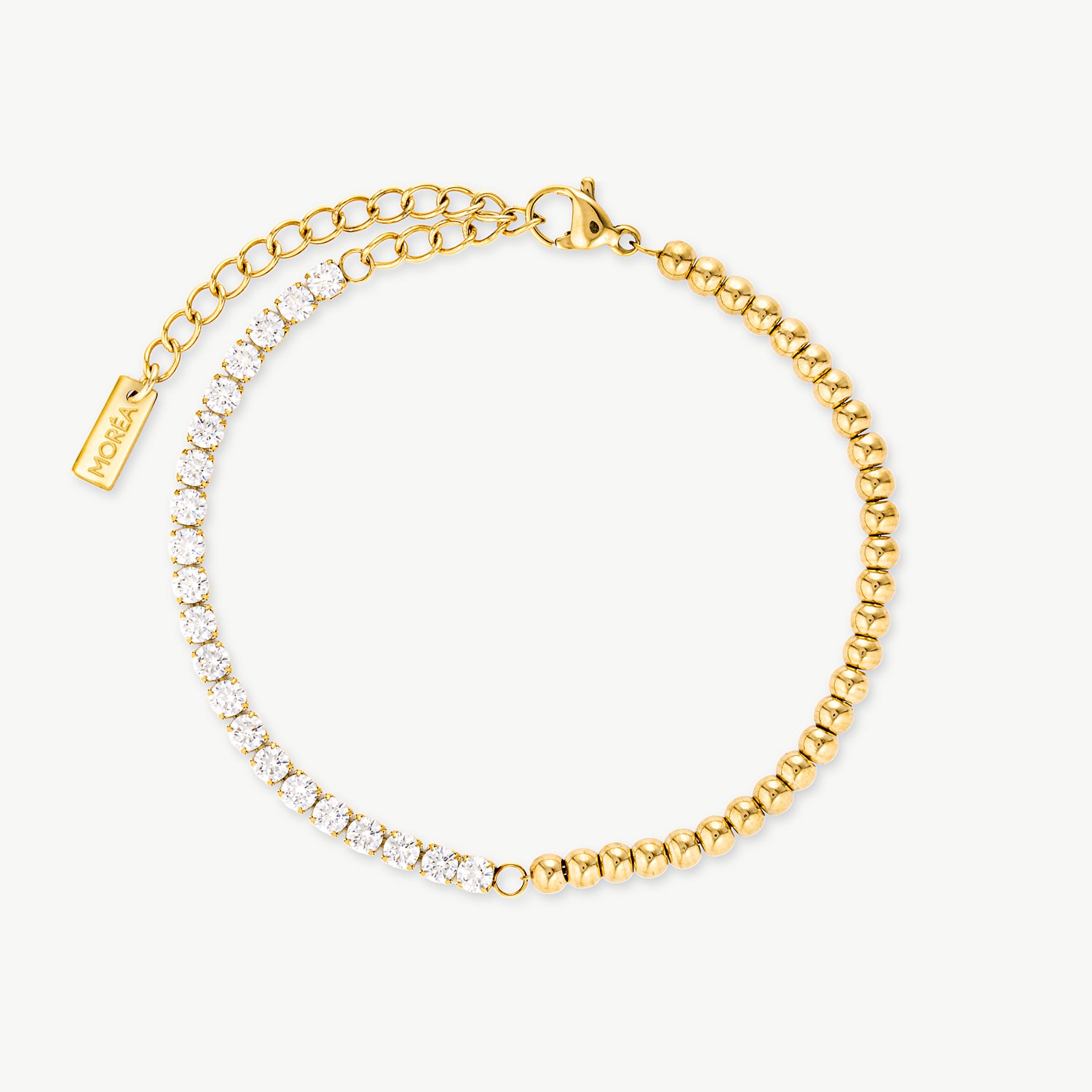 crystal tennis bracelet with sparkling clear stones and polished gold beads