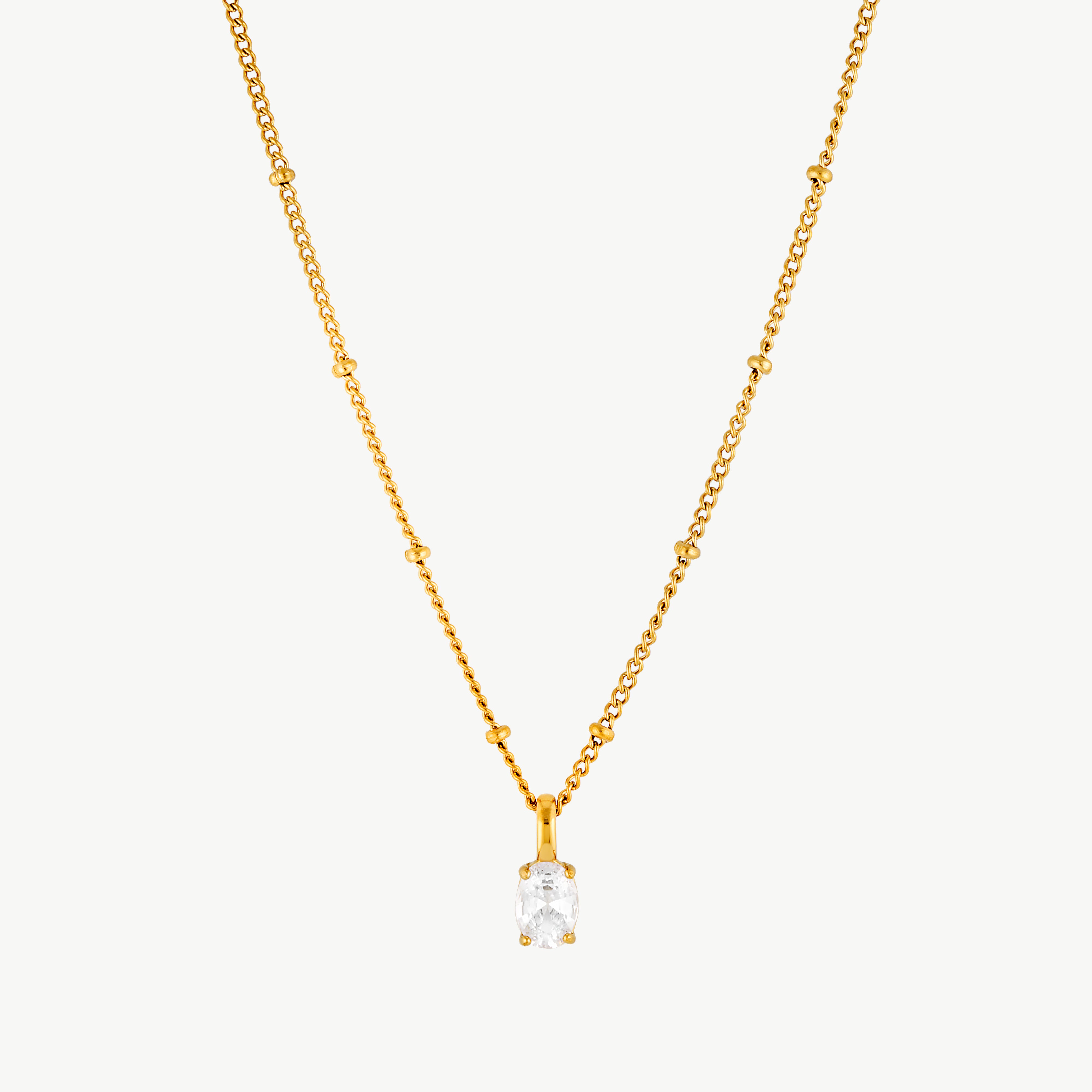 cubic zirconia solitaire necklace with brilliant clear solitaire stone pendant suspended from a delicate gold chain