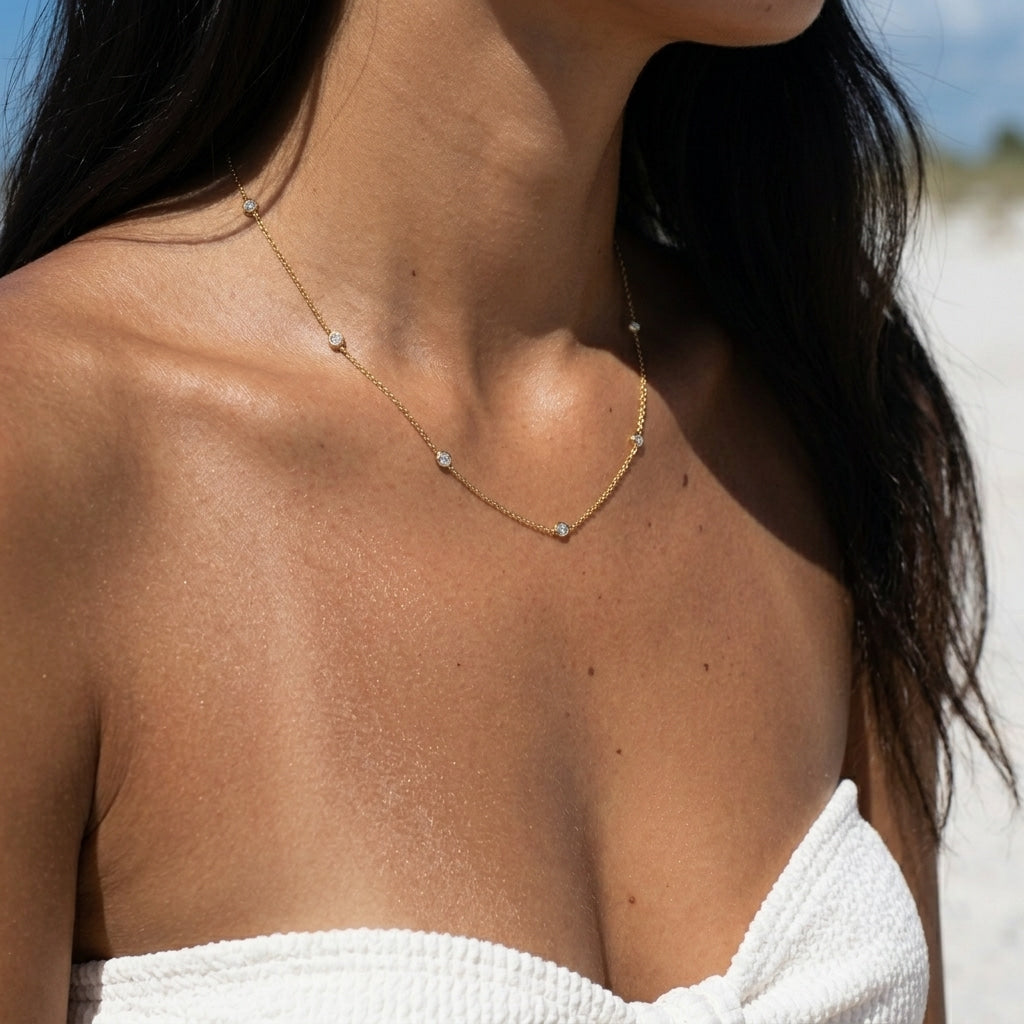 dainty CZ station necklace with delicate gold chain and spaced clear stones