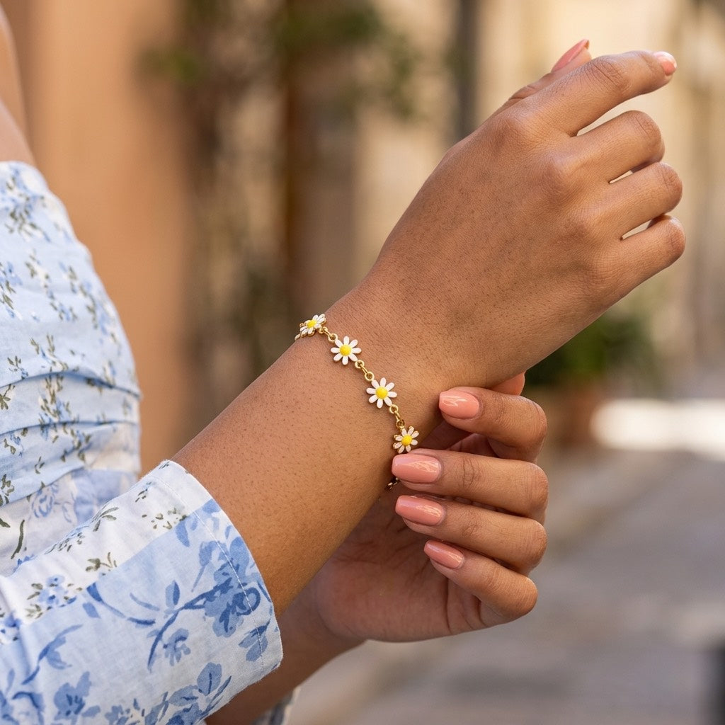 dainty daisy flower bracelet featuring petite white floral charms with golden yellow centers and delicate connecting links for cute everyday jewelry