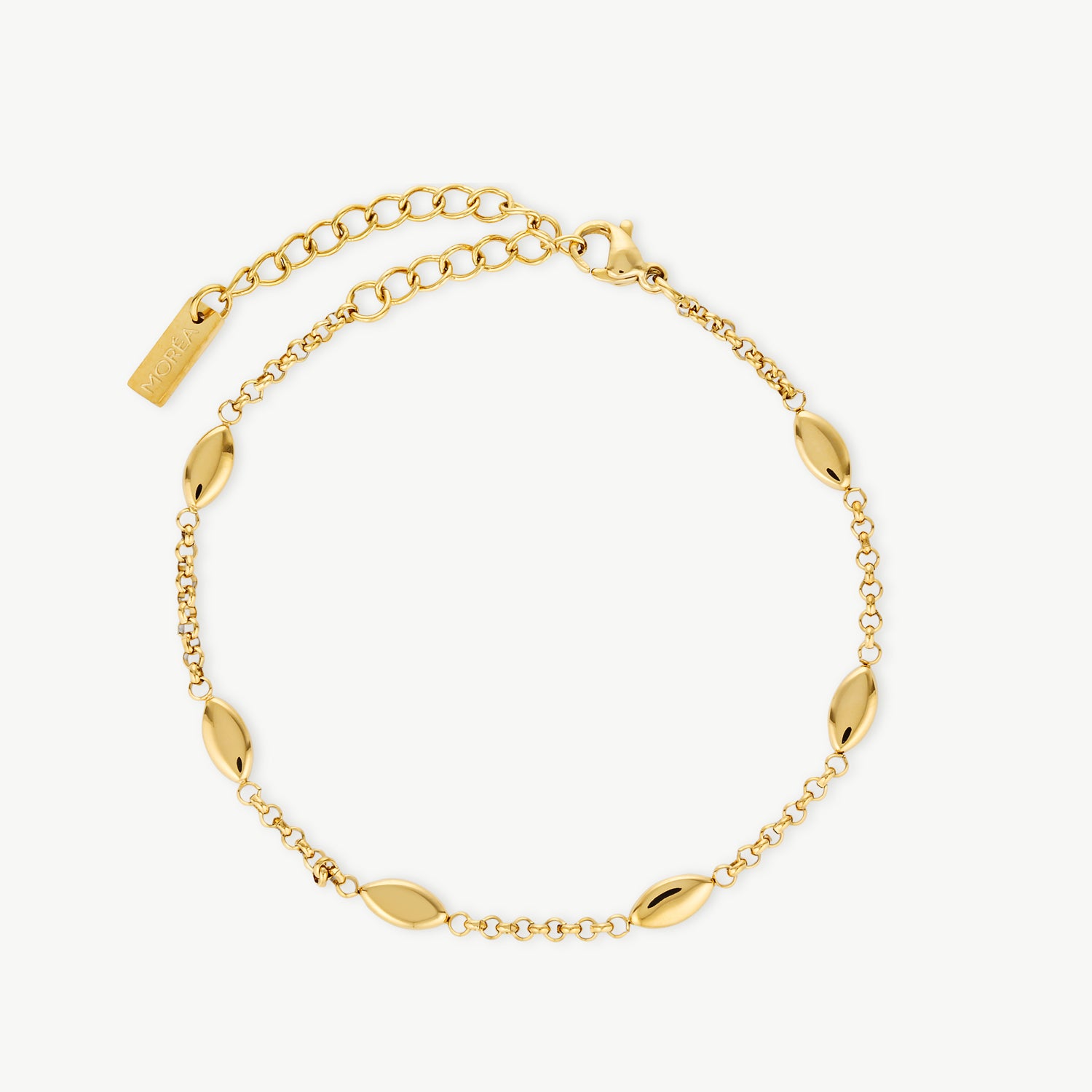 dainty gold bracelet with polished gold accents on a delicate chain