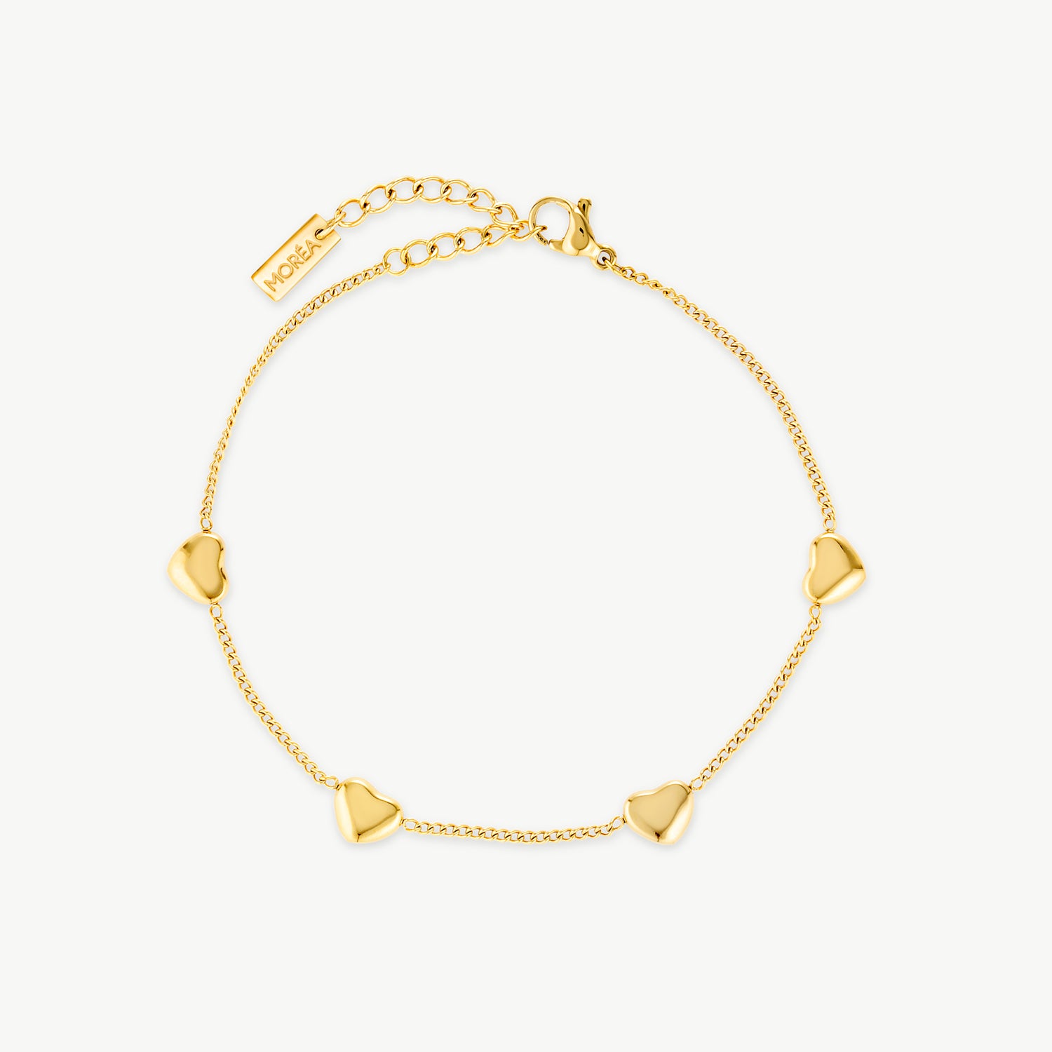 dainty heart bracelet with polished gold hearts spaced along a delicate gold chain