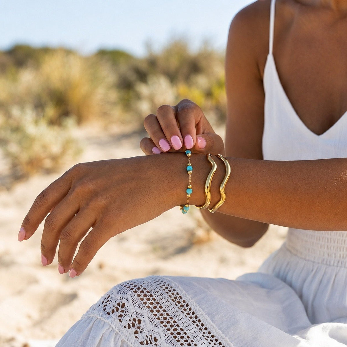 dainty turquoise bracelet for women featuring spaced blue beads on a gold chain