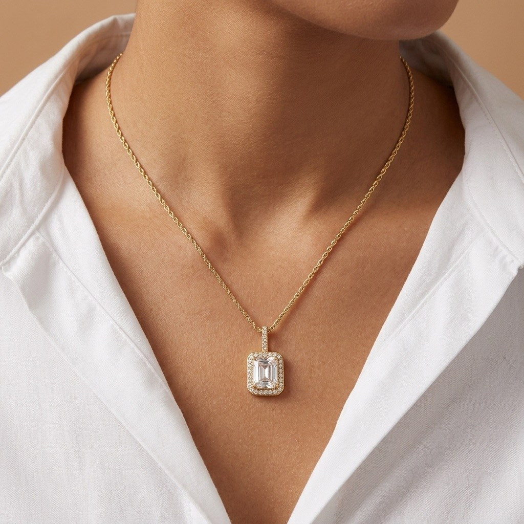 emerald cut crystal necklace with a rectangular clear stone pendant on a delicate gold chain