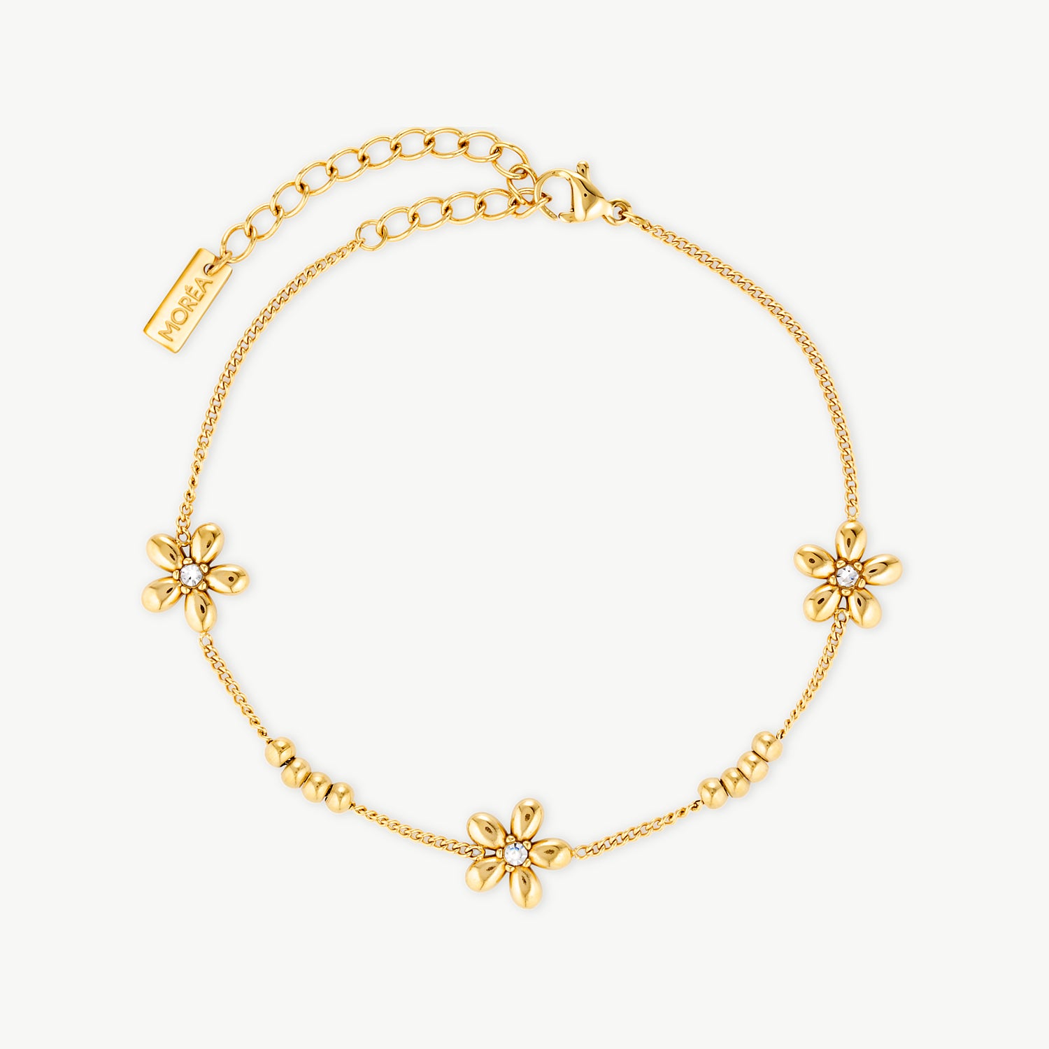 flower bead bracelet with polished gold floral accents and delicate gold beads on a fine chain