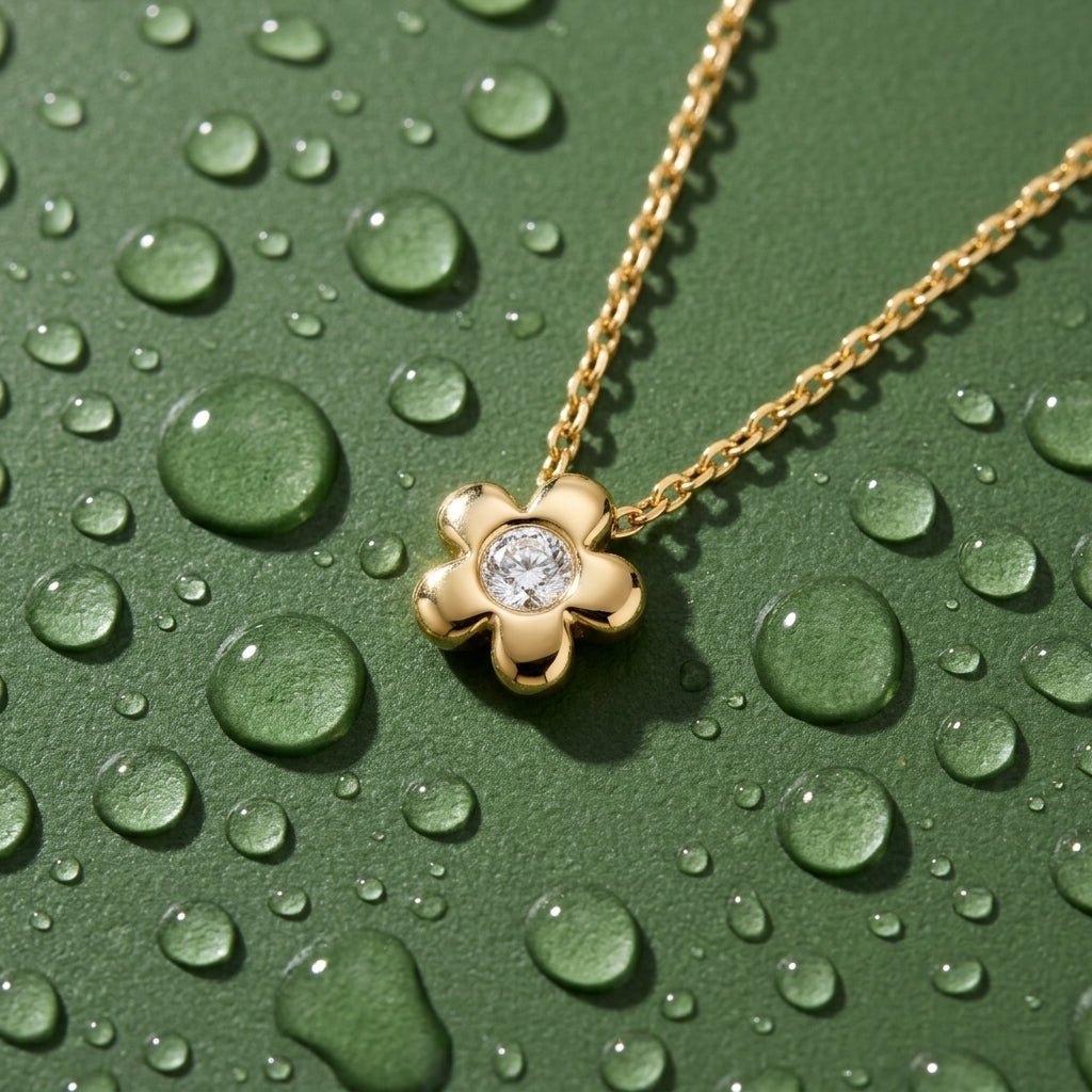 flower pendant necklace with gold petals and sparkling center stone
