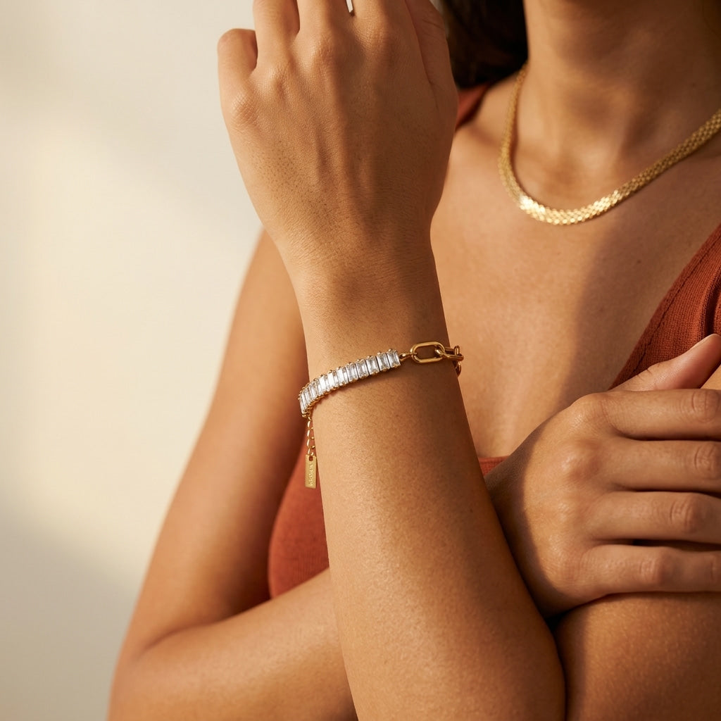 gold baguette tennis bracelet for women featuring a row of shimmering rectangular crystals and statement gold links for elegant everyday styling 