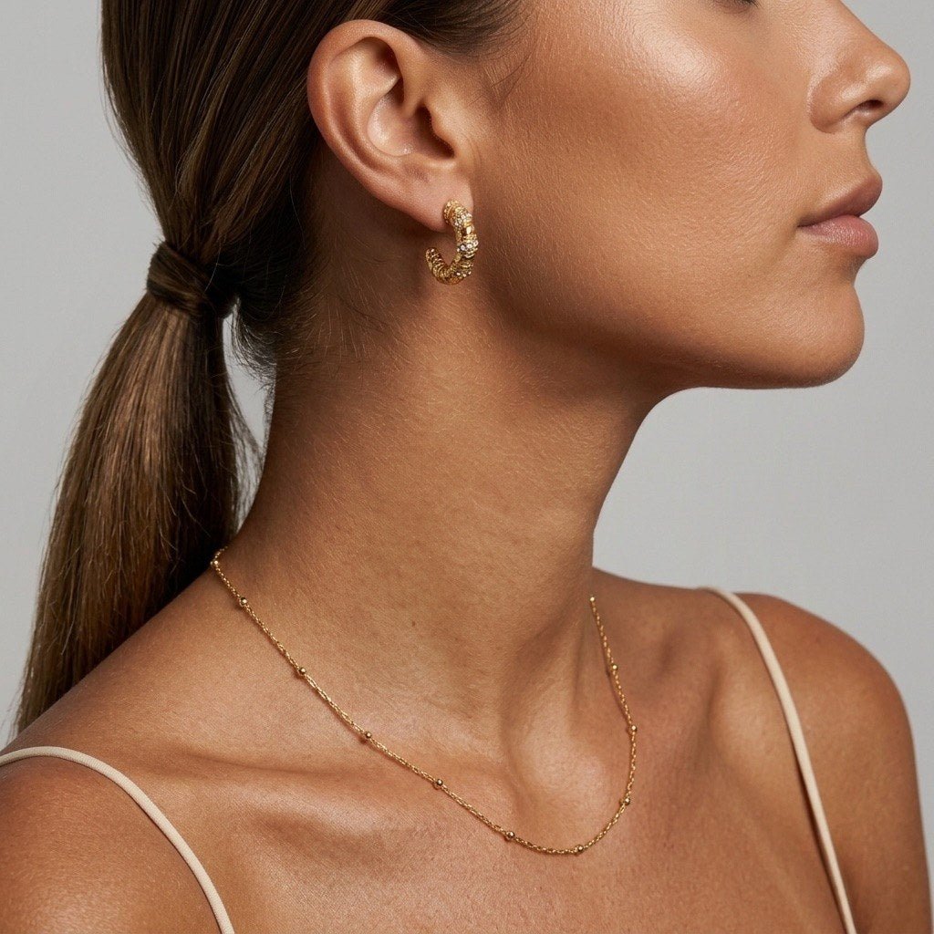 gold beaded chain necklace featuring delicate spaced beads on a fine minimalist chain