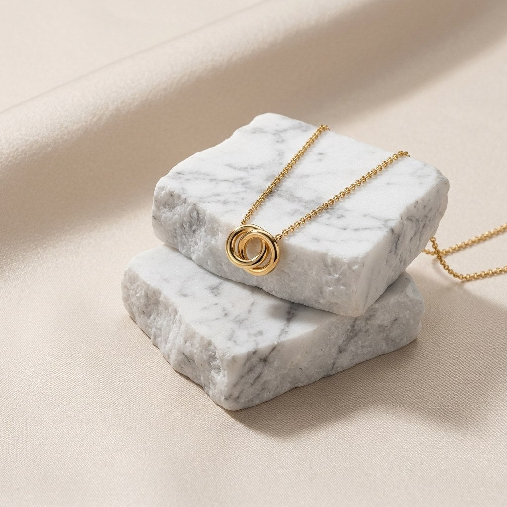 gold circle link necklace featuring intertwined round rings as a sleek minimalist pendant