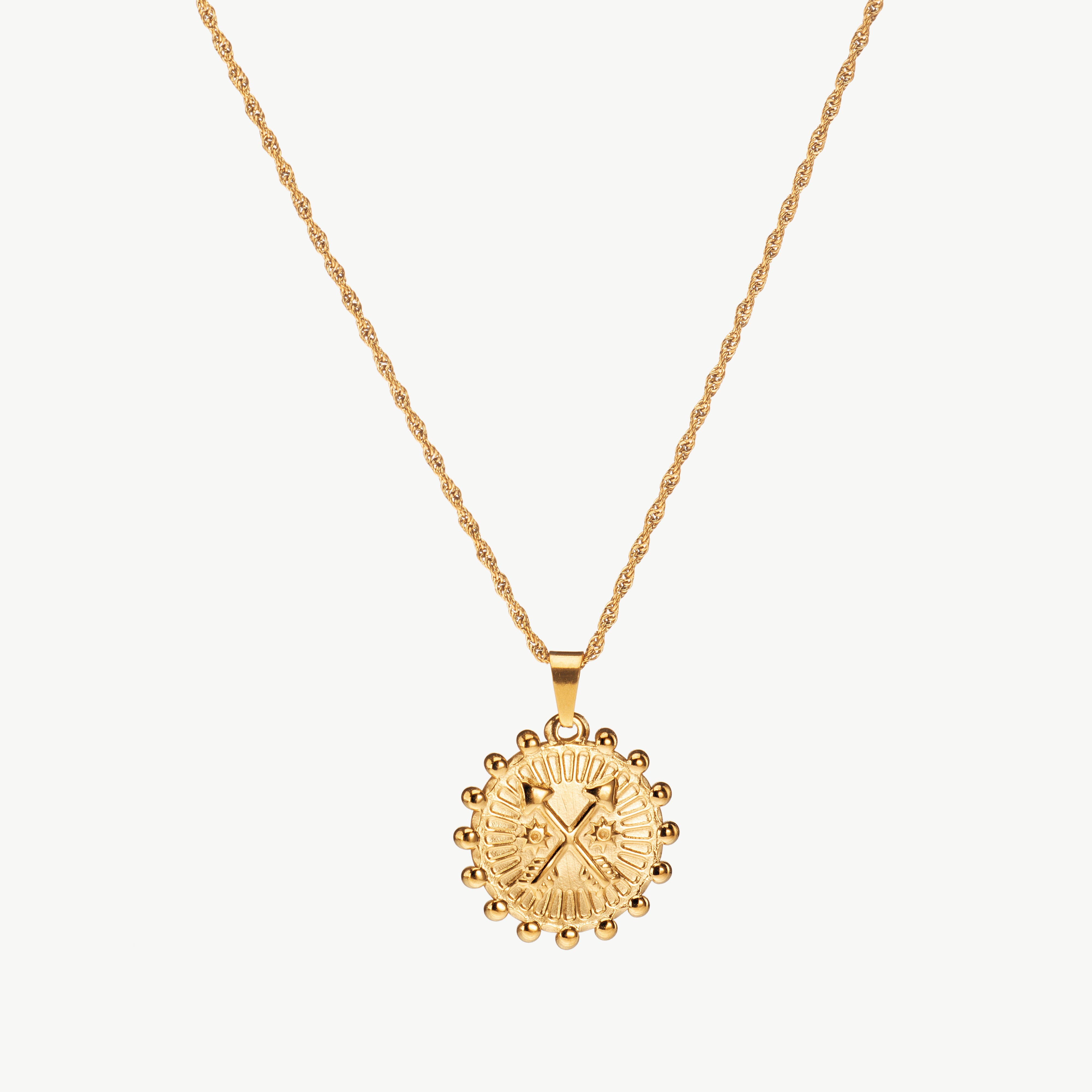 gold compass necklace with round pendant detail, compass necklace gold and compass charm necklace centered along a fine chain with directional markings