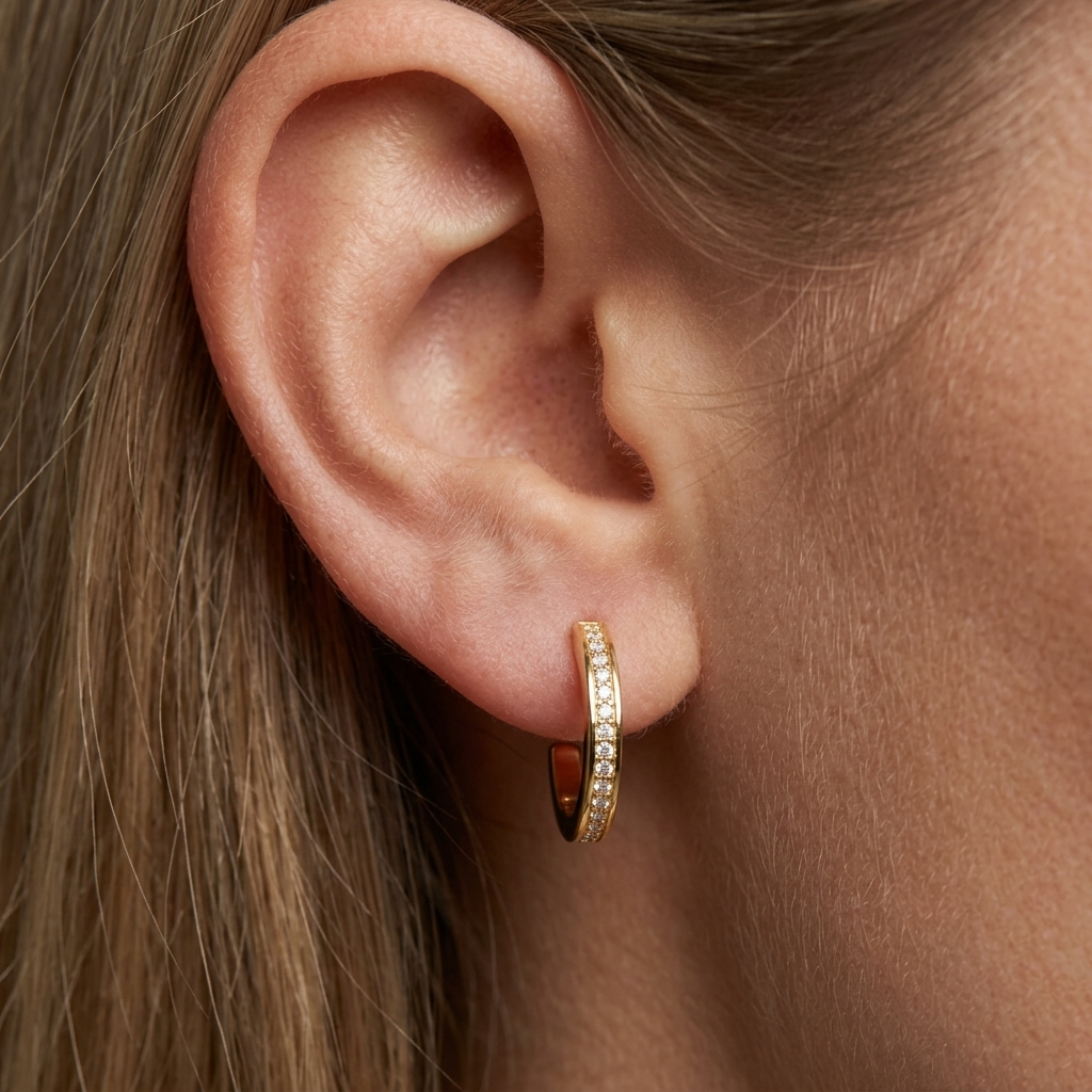 gold crystal hoop earrings featuring delicate round sparkling stones in a polished gold setting for a timeless and feminine jewelry look