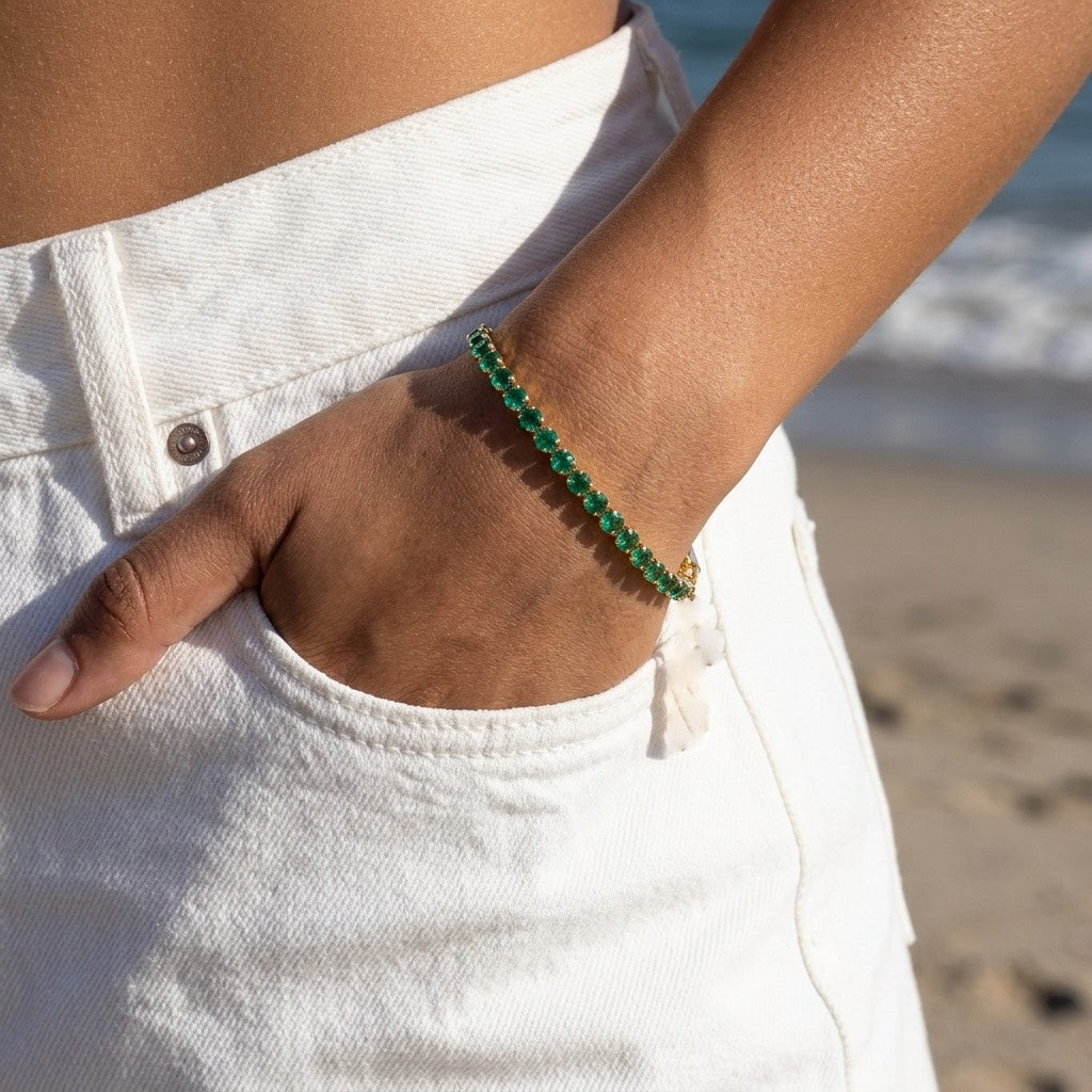 gold green crystal bracelet for women featuring vibrant green round crystals in delicate gold prong settings for timeless everyday styling 