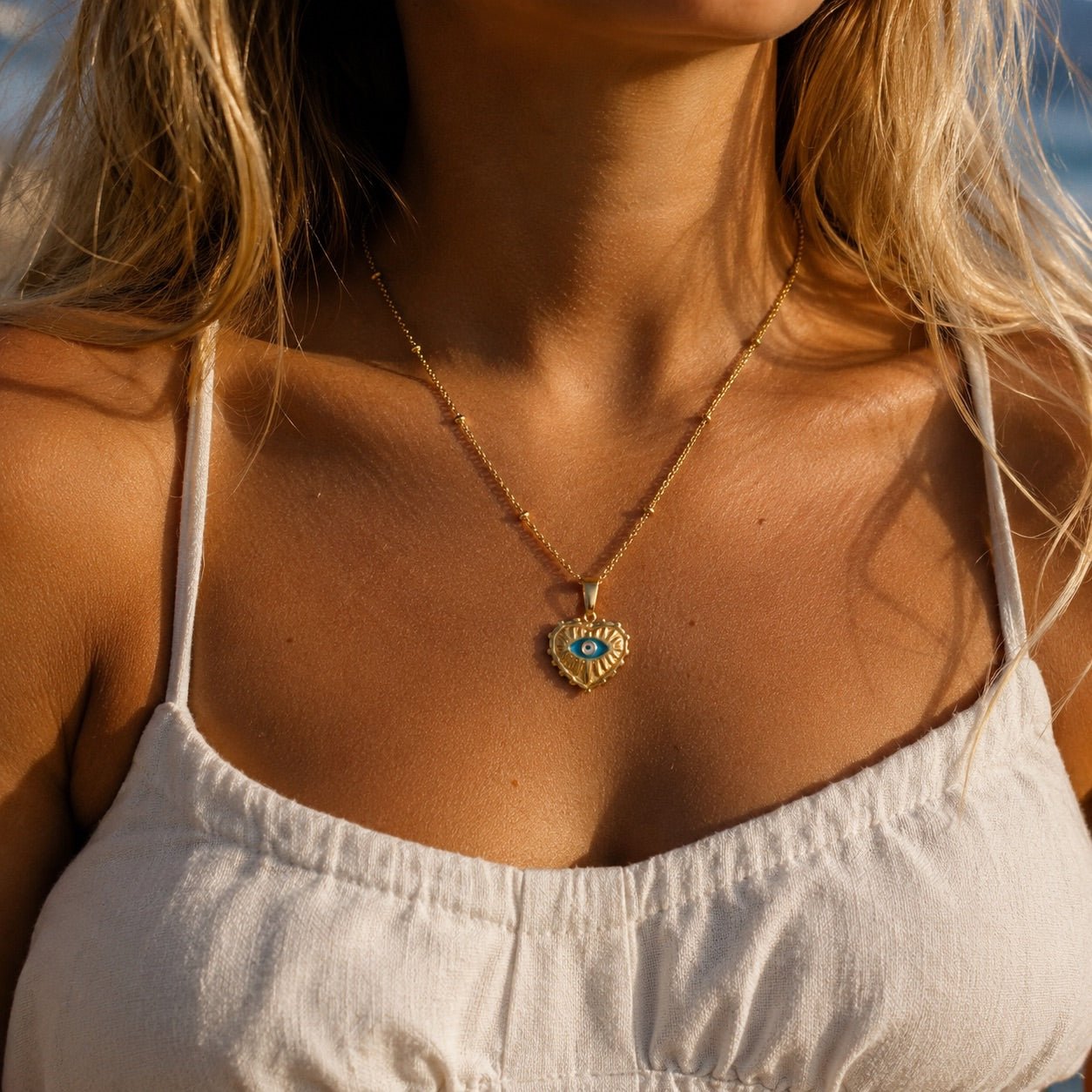 gold plated evil eye necklace with blue eye  heart pendant