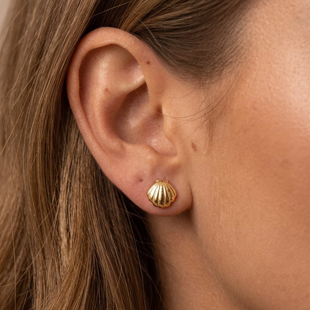 gold seashell earrings with a classic scallop shell design