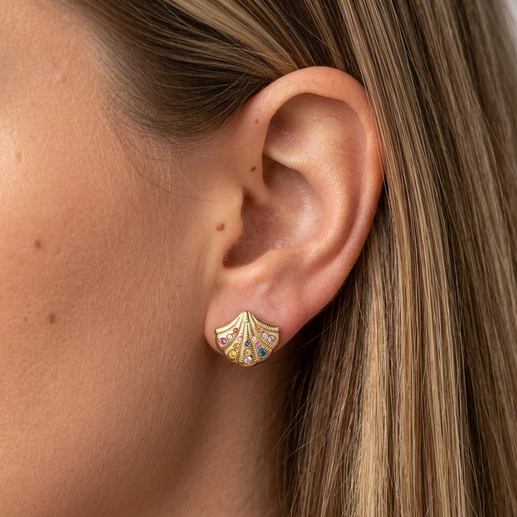 gold shell stud earrings featuring colorful sparkling stones