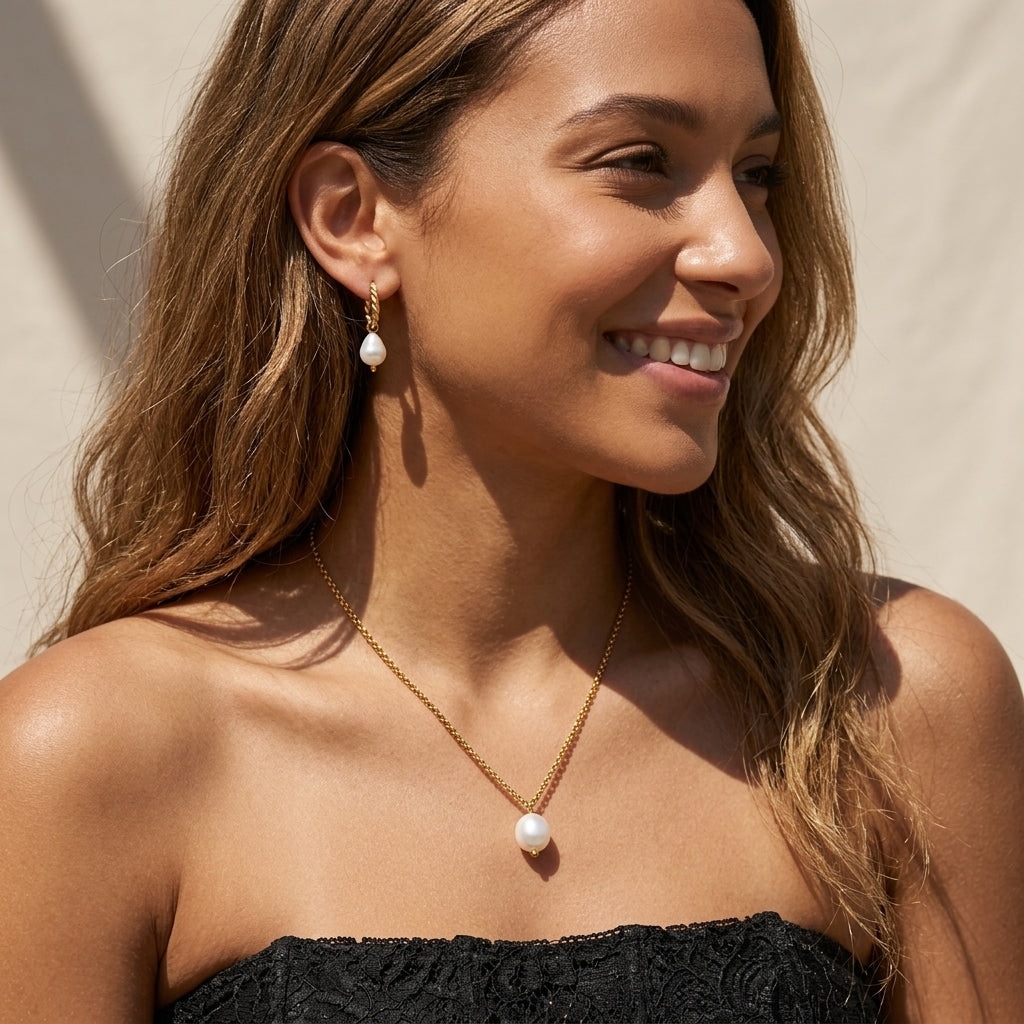 gold single pearl pendant necklace with a delicate chain