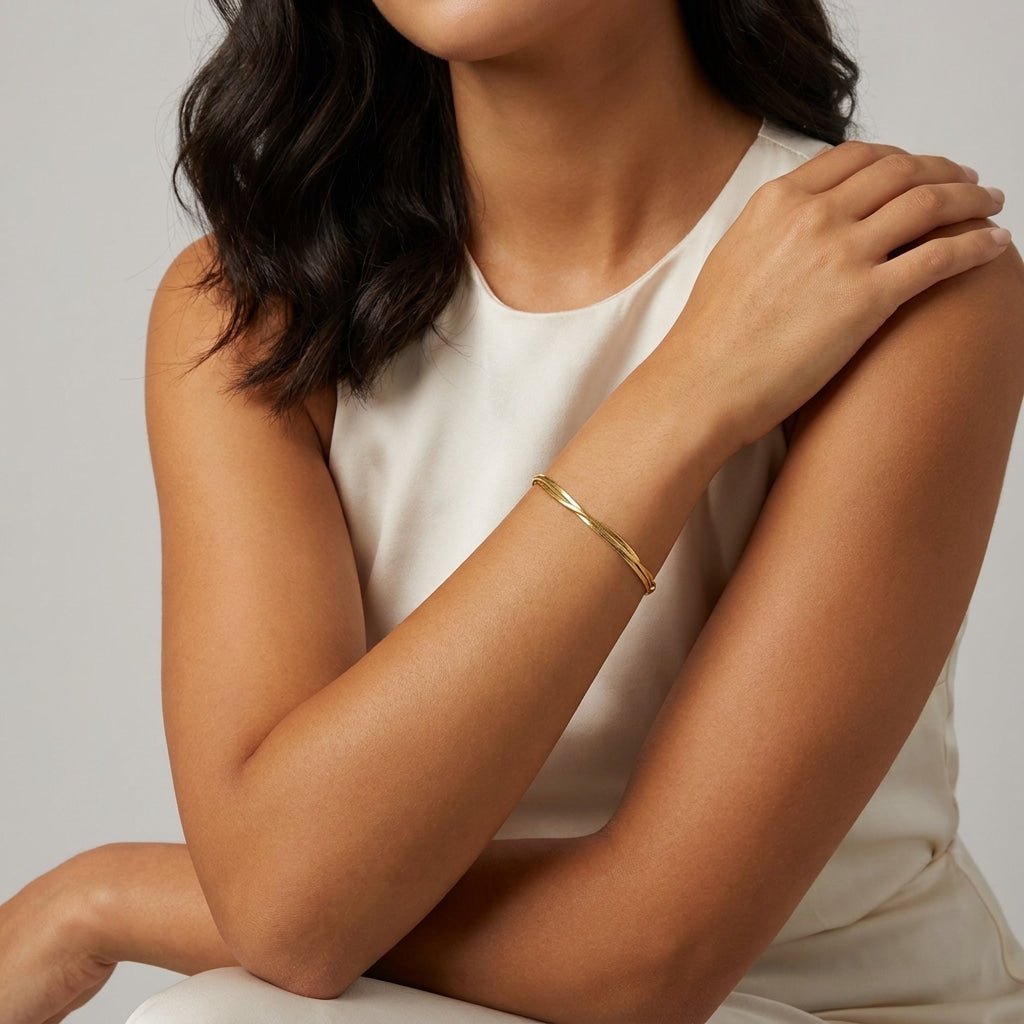 delicate gold snake chain bracelet worn on the wrist 