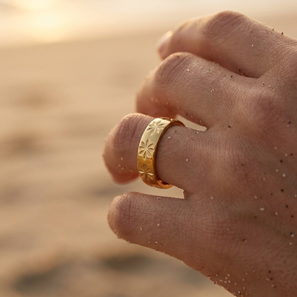 gold star band with engraved star motifs and a smooth polished finish