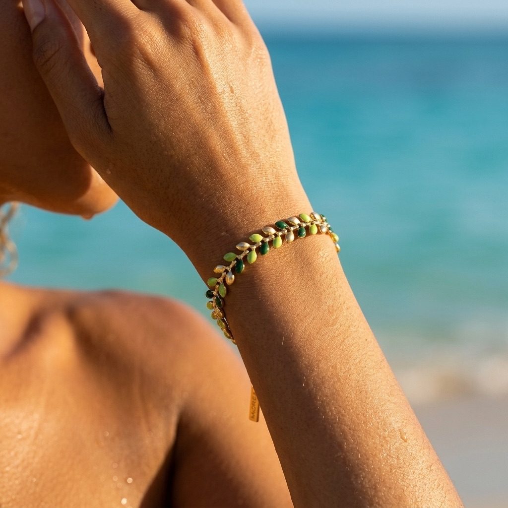 green olive branch bracelet featuring elegant leaf-shaped details with a polished gold-tone finish