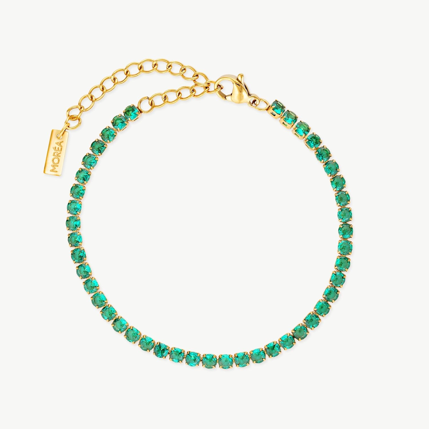 green tennis bracelet with vivid green cubic zirconia stones in polished gold settings