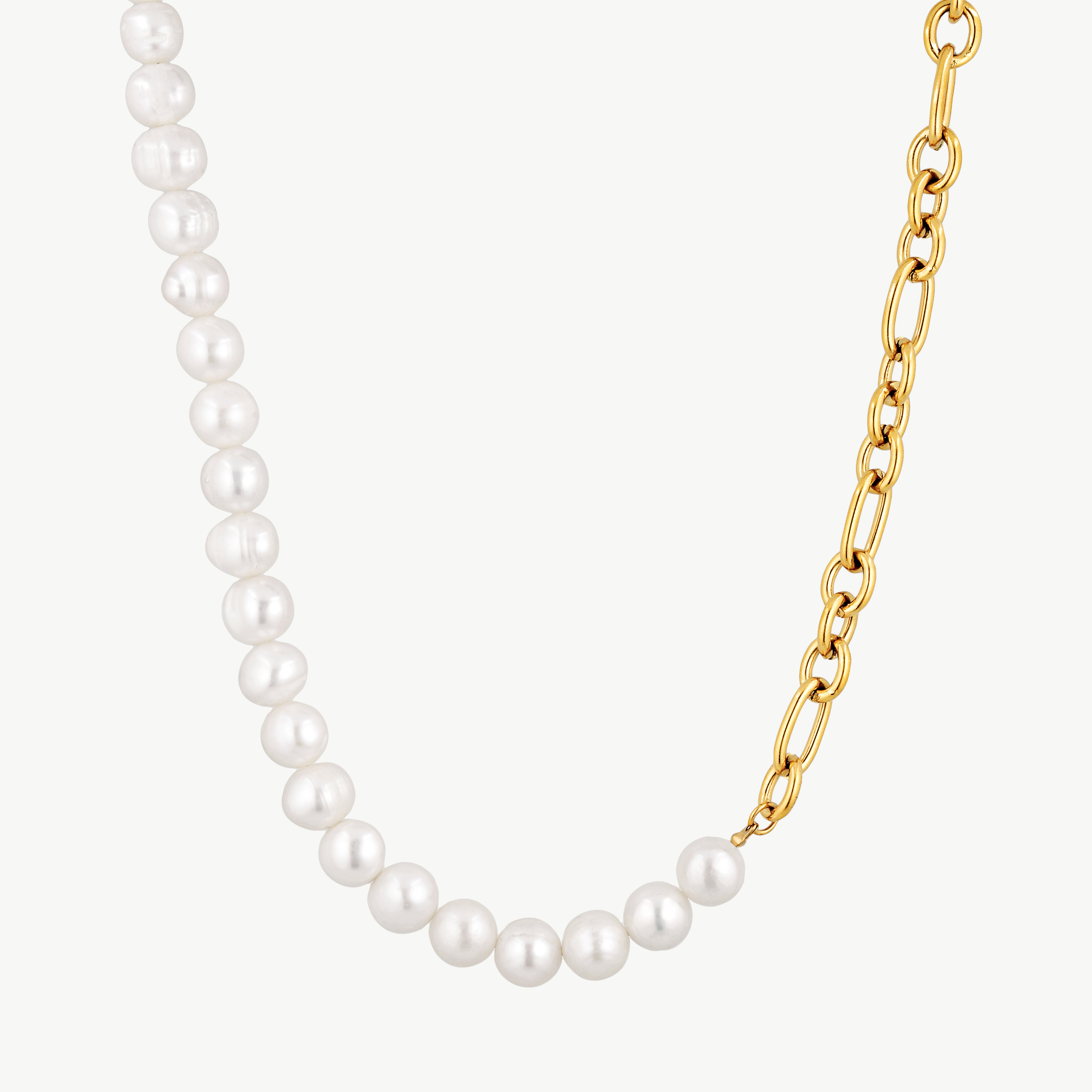 half pearl half chain necklace with white pearl strand and polished elongated gold links in an asymmetric design