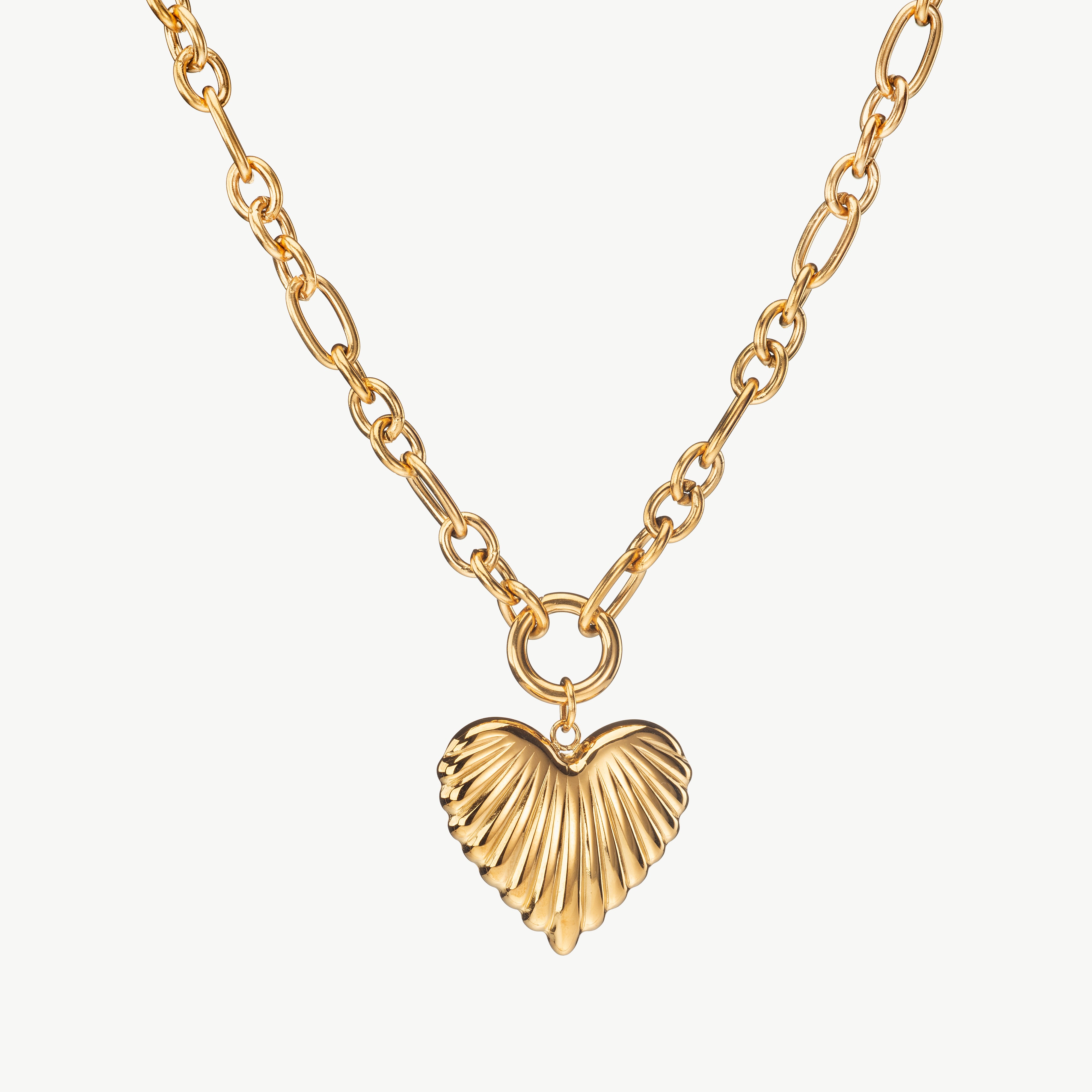 heart charm necklace in gold with large heart pendant, chunky heart charm necklace with polished finish and chunky heart necklace look