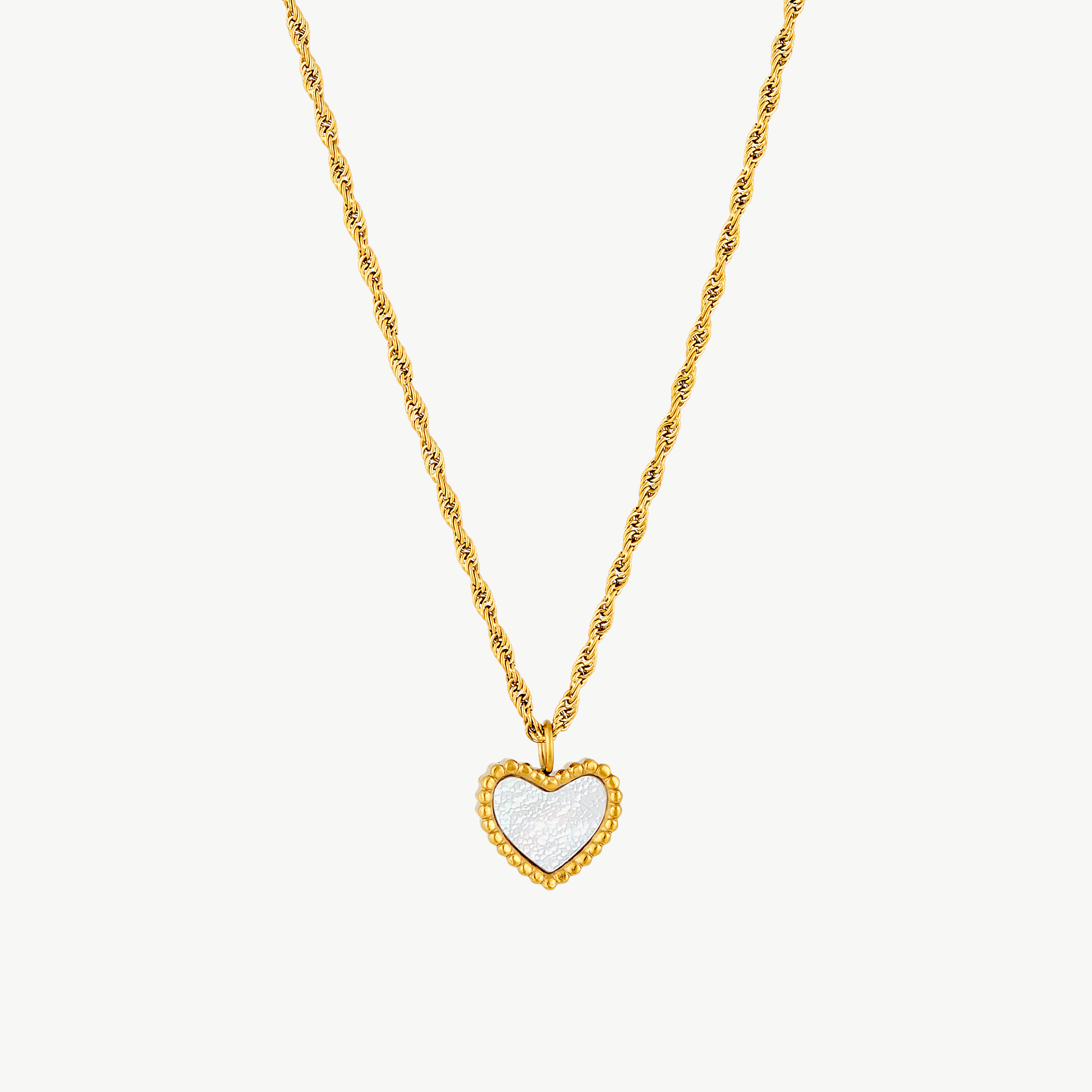 heart pendant necklace with luminous white heart center framed by sparkling cubic zirconia on a textured gold chain
