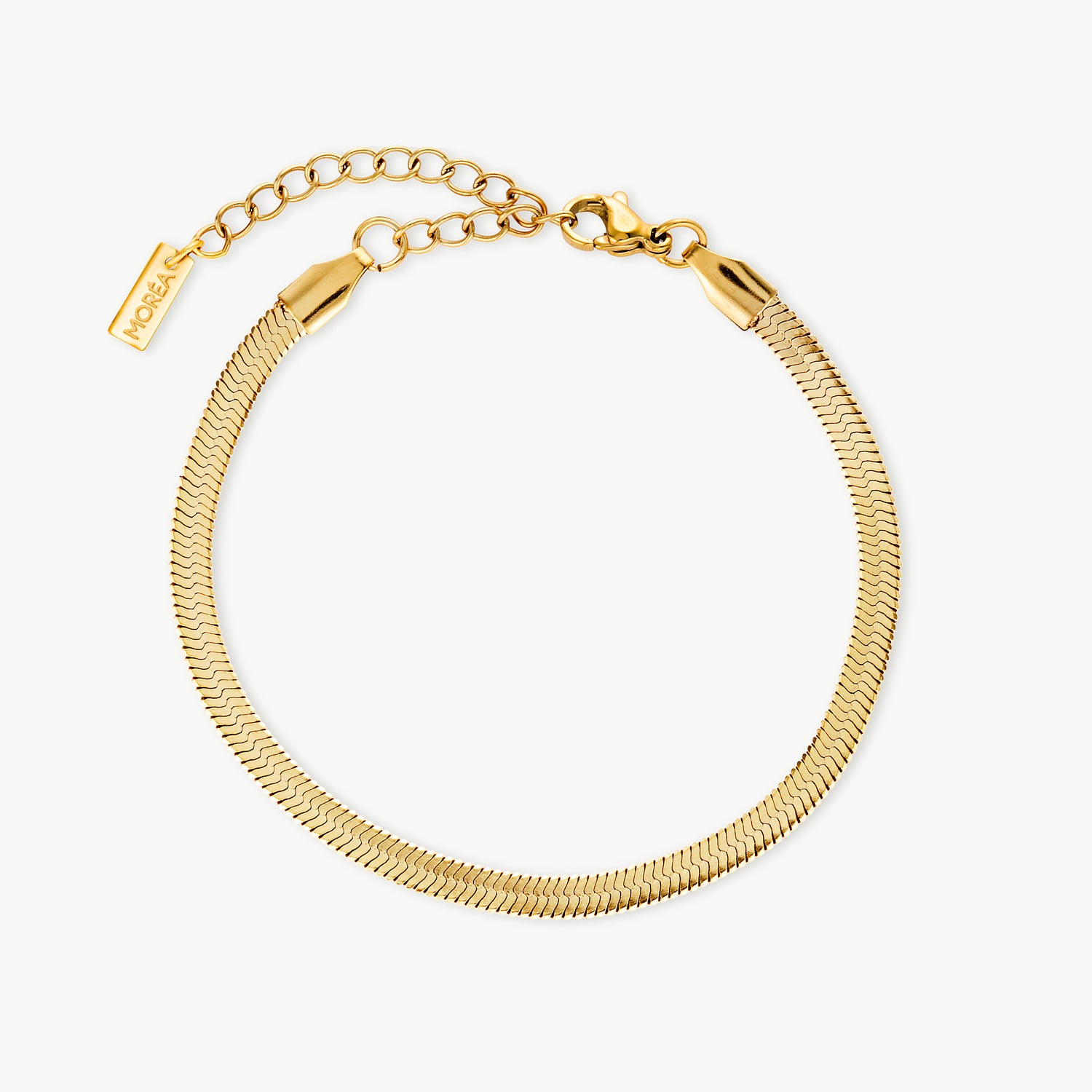 gold herringbone chain bracelet with a smooth flat woven finish and polished shine