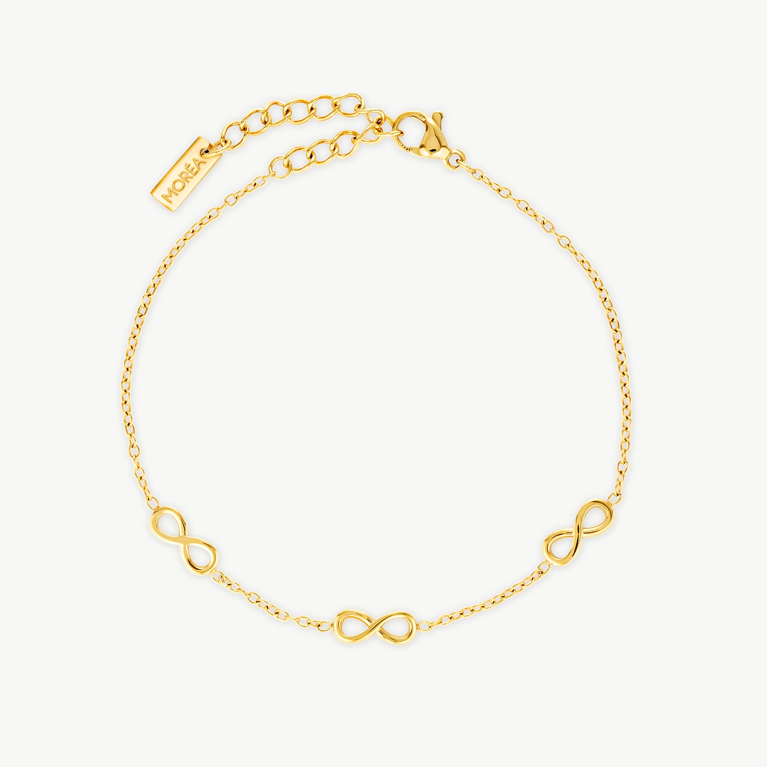 gold infinity bracelet with polished infinity symbols spaced along a delicate chain