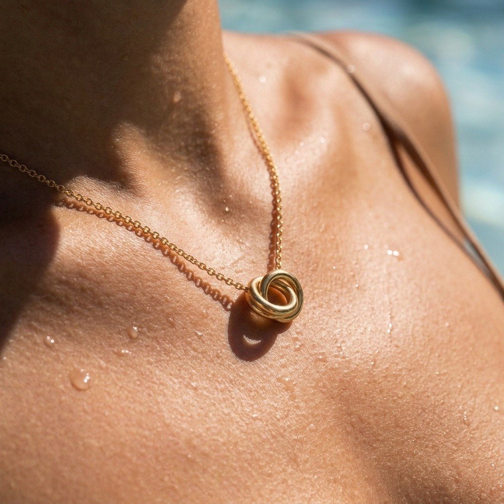 intertwined ring pendant necklace featuring overlapping gold-tone circles on a delicate chain