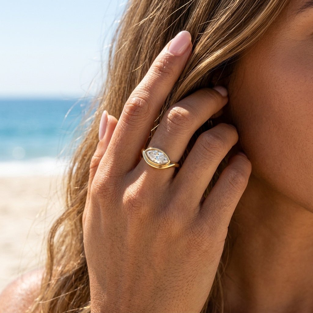 marquise stone ring with a sparkling elongated setting and polished gold band