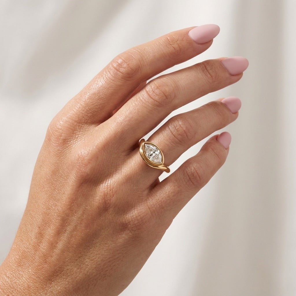 marquise zirconia ring featuring brilliant stones in an elegant gold setting