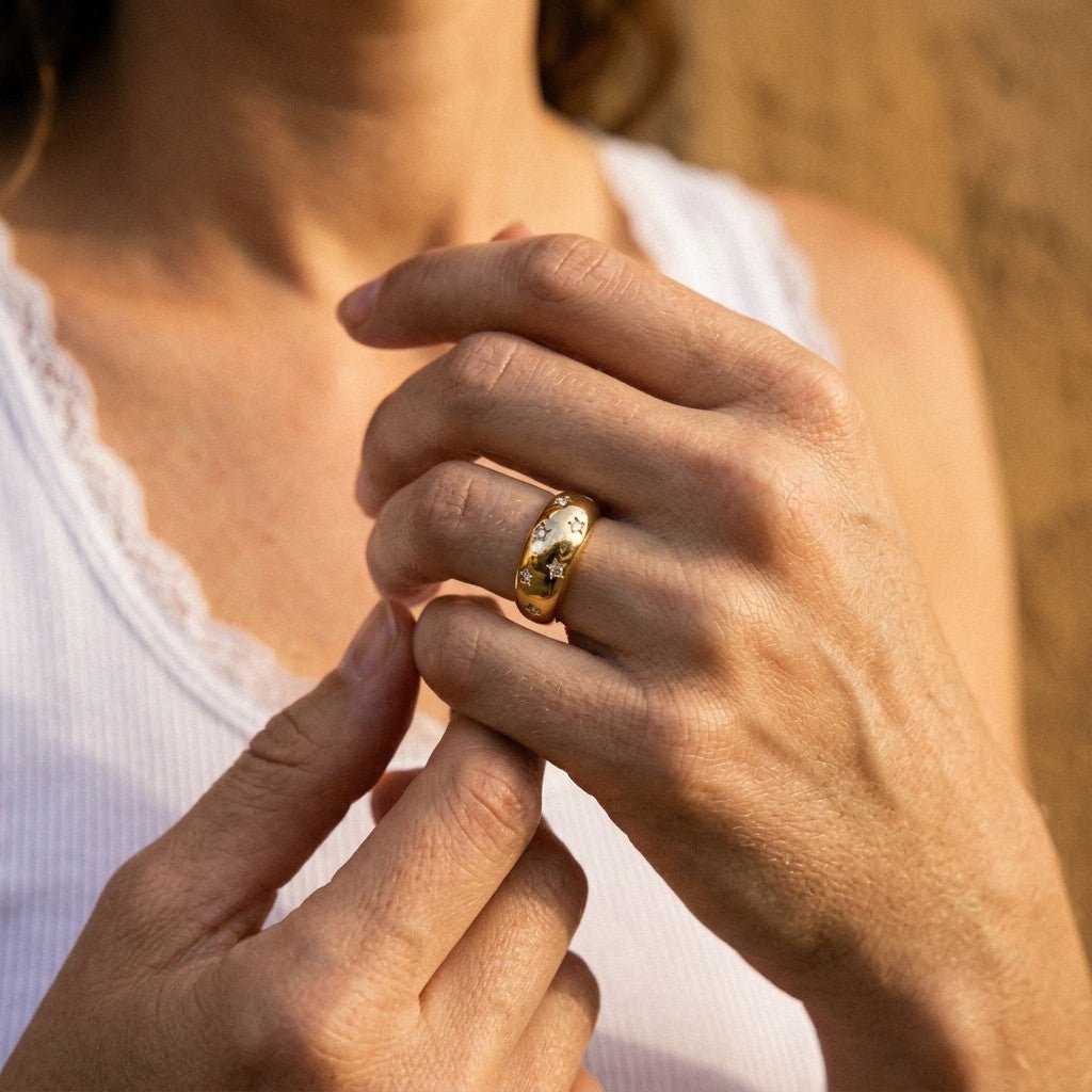 moon star gold ring with sparkling celestial details and a bold polished band, worn on hand