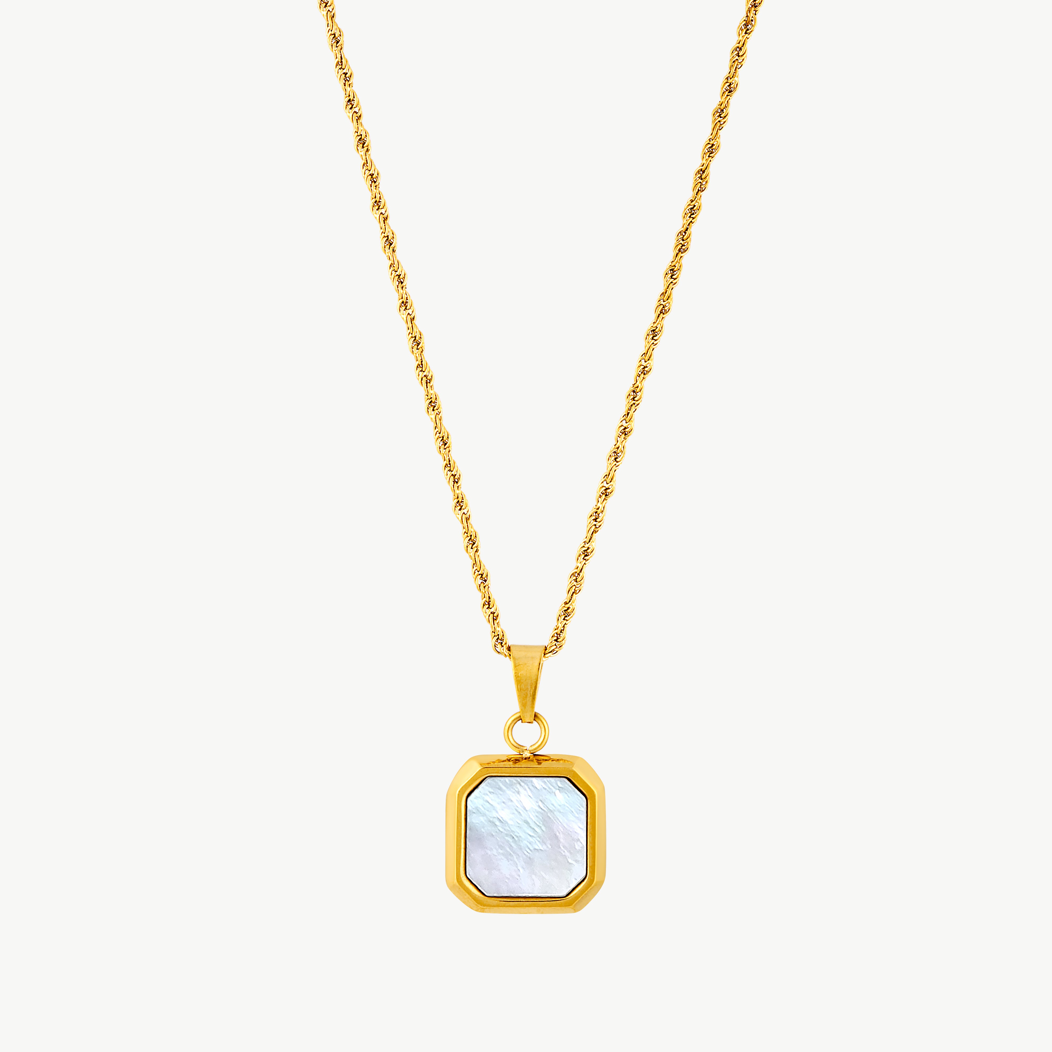 mother of pearl pendant necklace with iridescent square mother of pearl centerpiece framed in a polished geometric gold setting