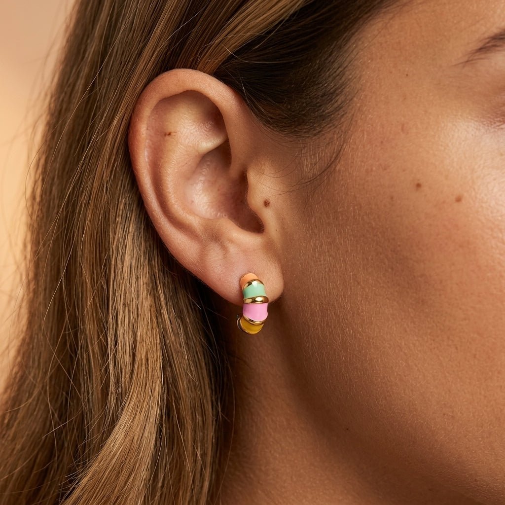 multicolor gold earrings with bright enamel bands and chunky hoop design