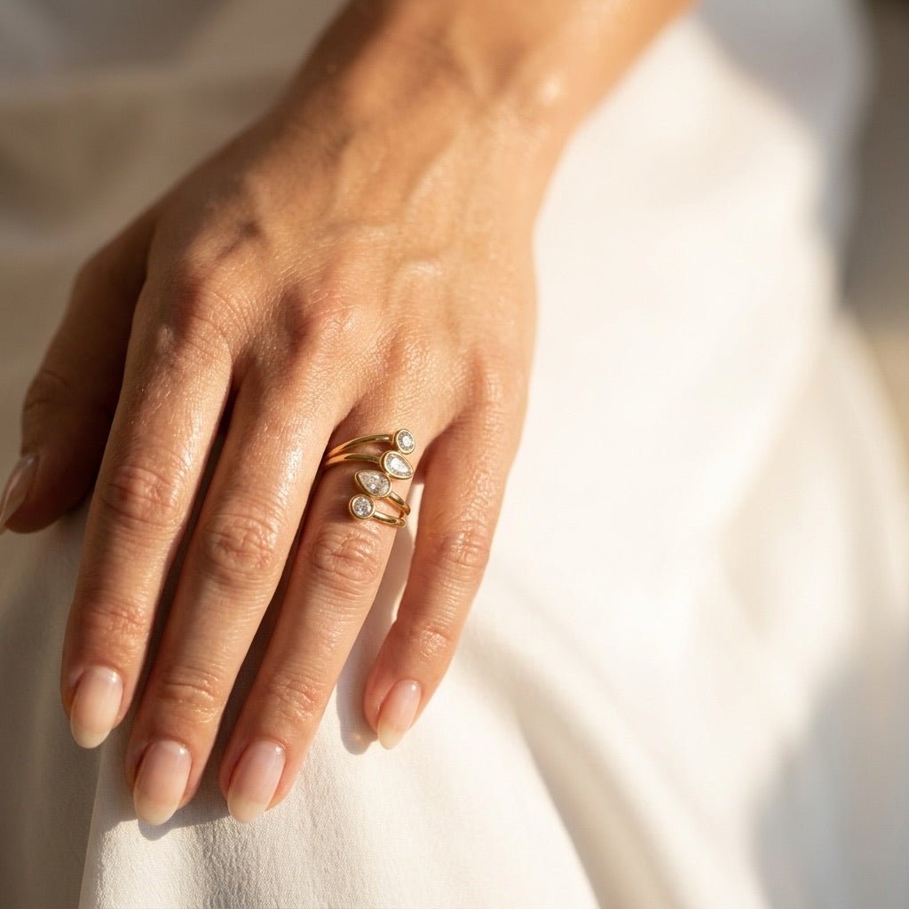 multiple stone gold band with clear sparkling stones and an elegant layered open design